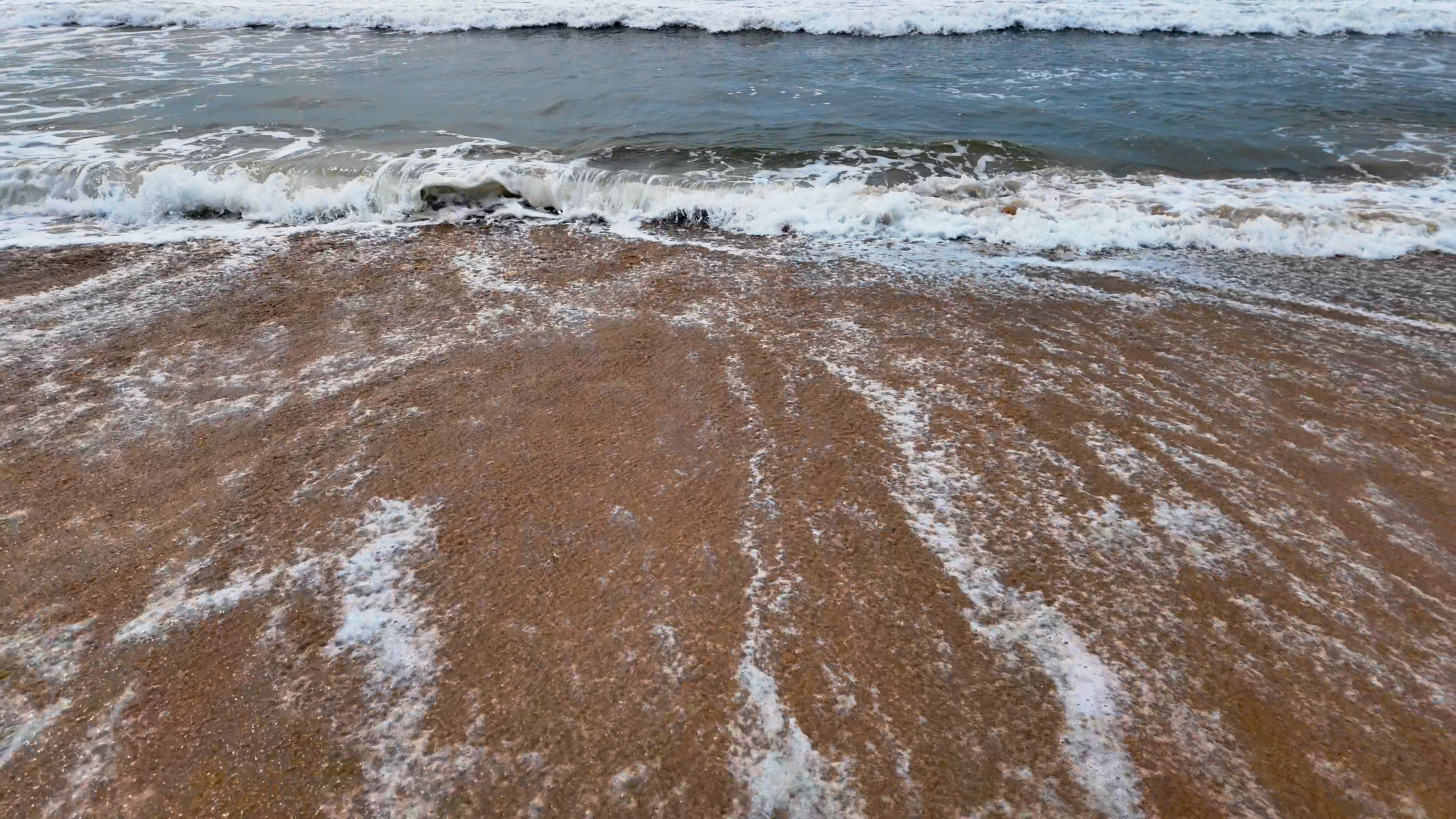 Waves Foam Crashing Seashore 4K Dynamic Shot
