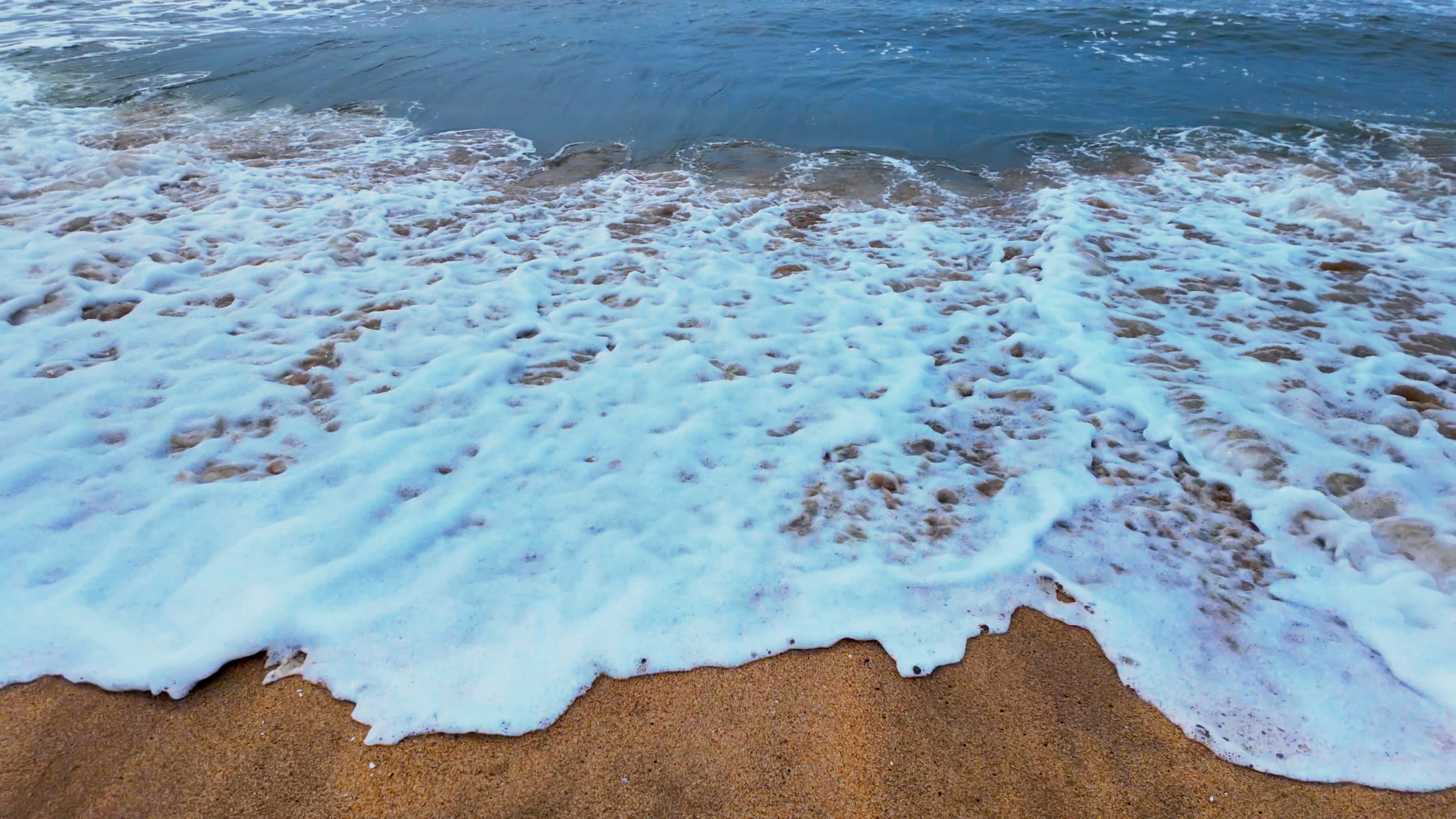 Tide Waves Foam Crashing Coast 4K Dynamic Shot