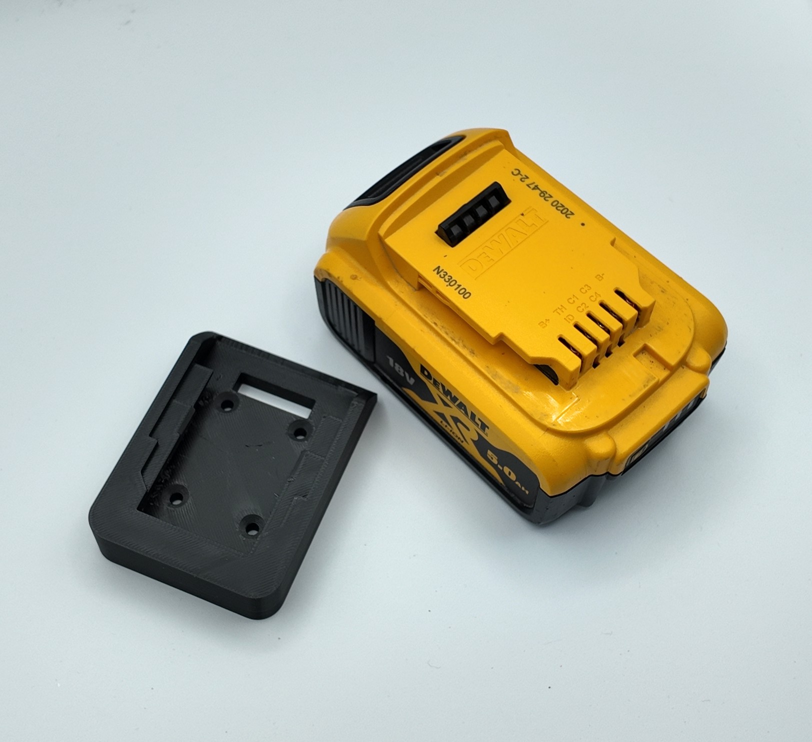Battery cover and wall mount to fit a Dewalt Battery. Protect and Store up to 20V Tool Batteries. Dust Cap with Screw Mount for DeWalt Battery.