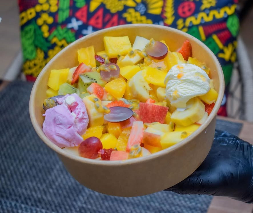 Fruit salad with ice cream scoops