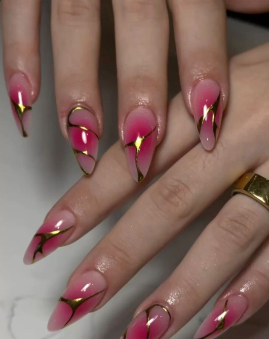 Elegant Pink and Gold Stiletto Nails