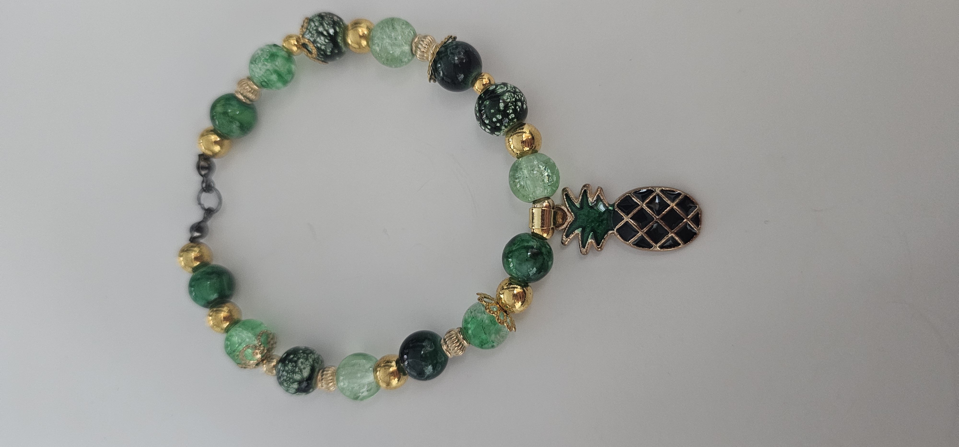 Green and Gold Beaded Bracelet with Pineapple Charm