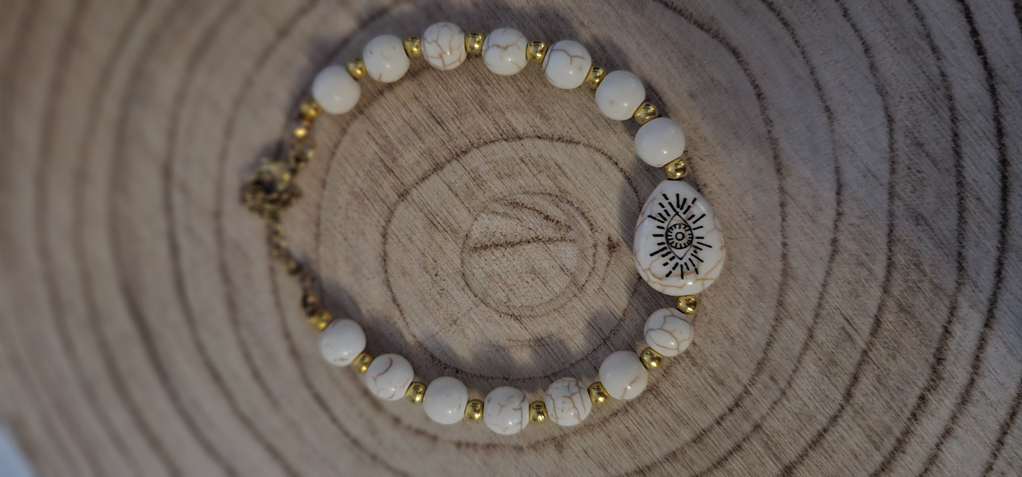 White Beaded Sun Symbol Bracelet