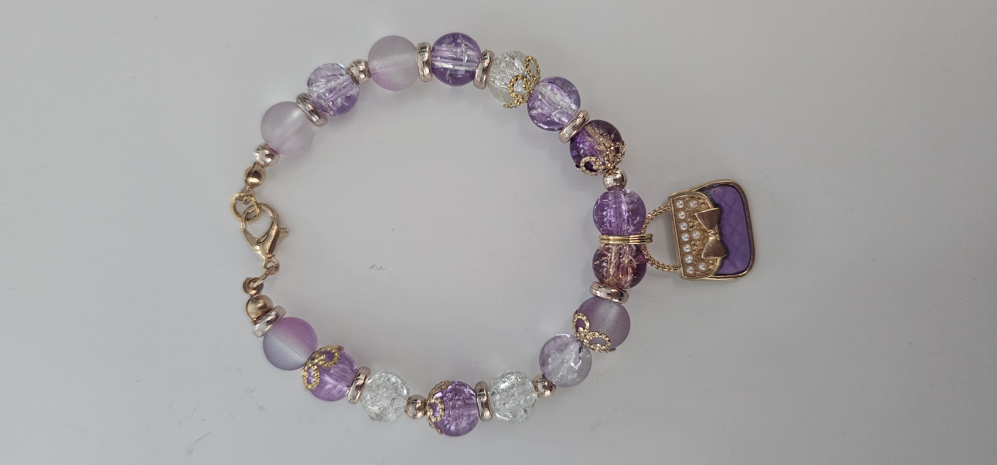 Purple and White Beaded Bracelet with Purse Charm