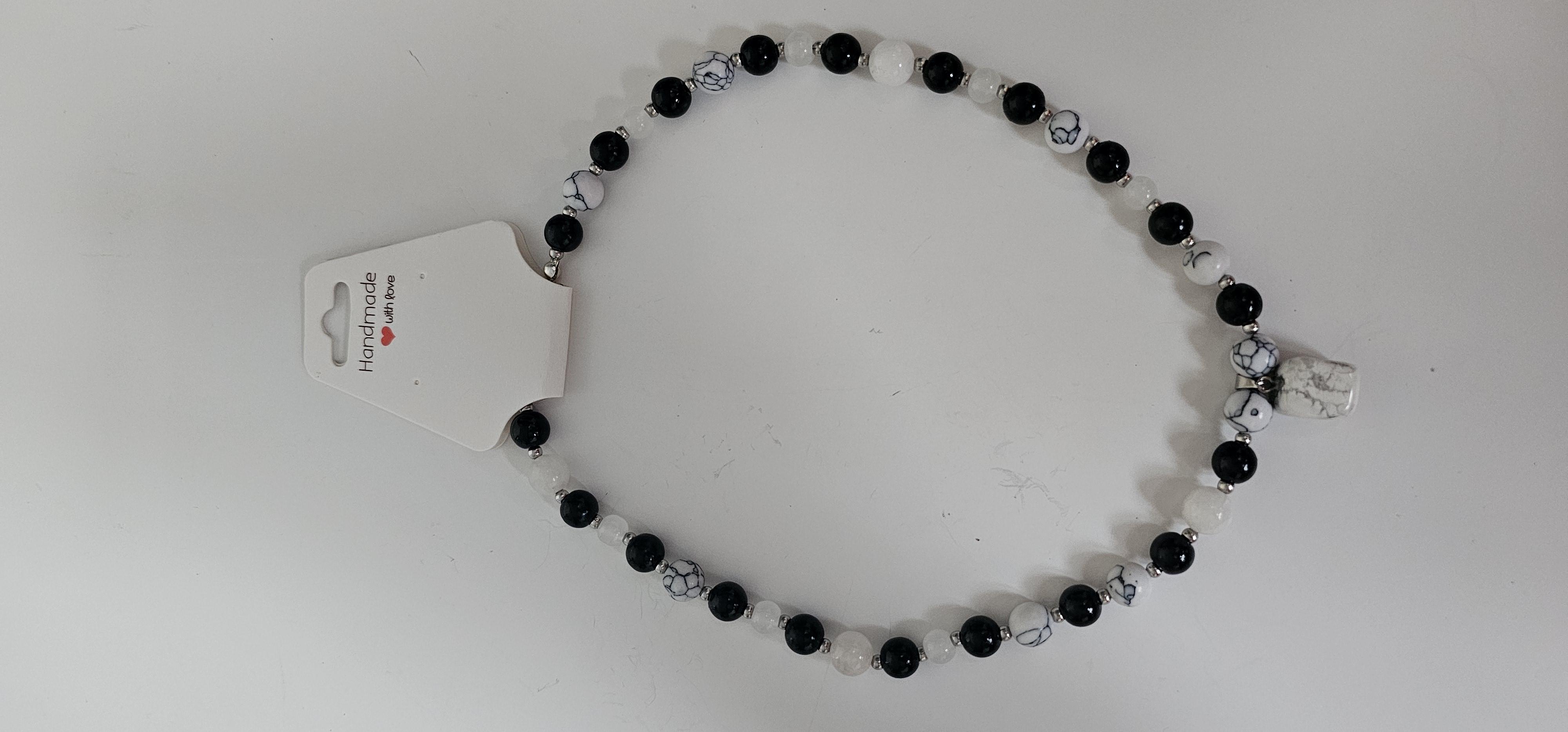 Black and White Beaded Necklace with White Stone Pendant