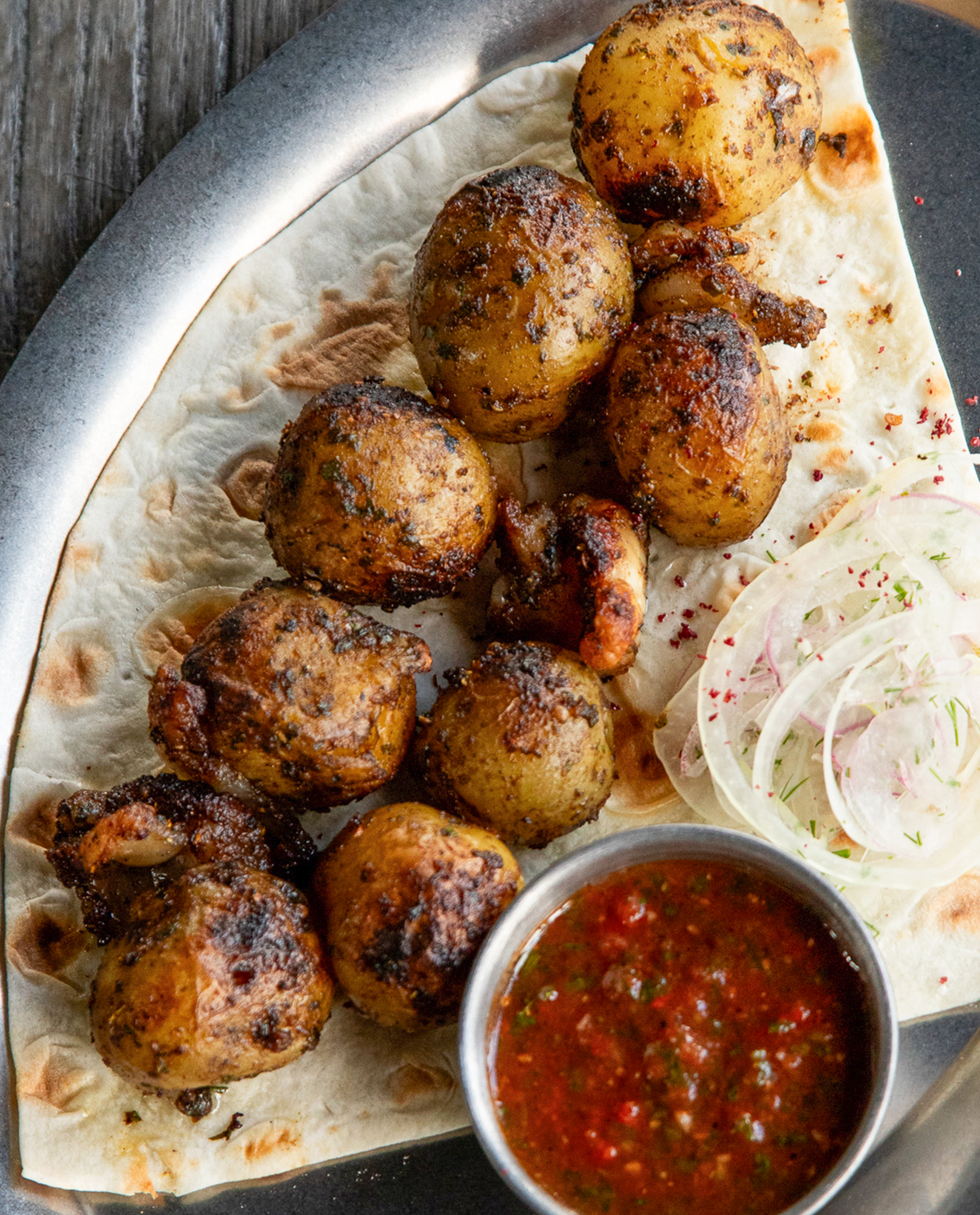 Grilled baby potatoes with lamb fat