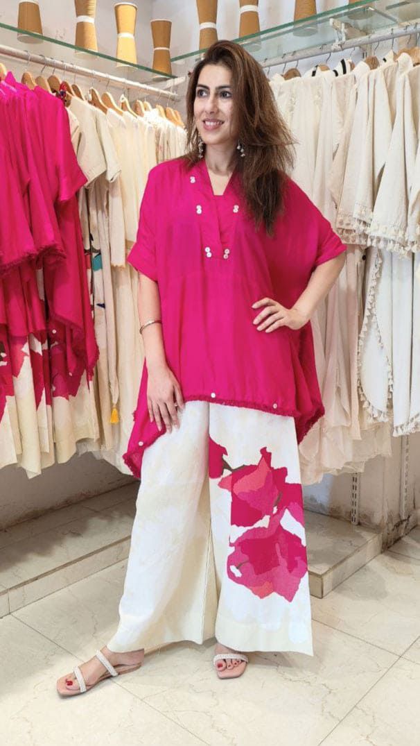 Pink asymmetrical tunic and floral wide-leg pants set