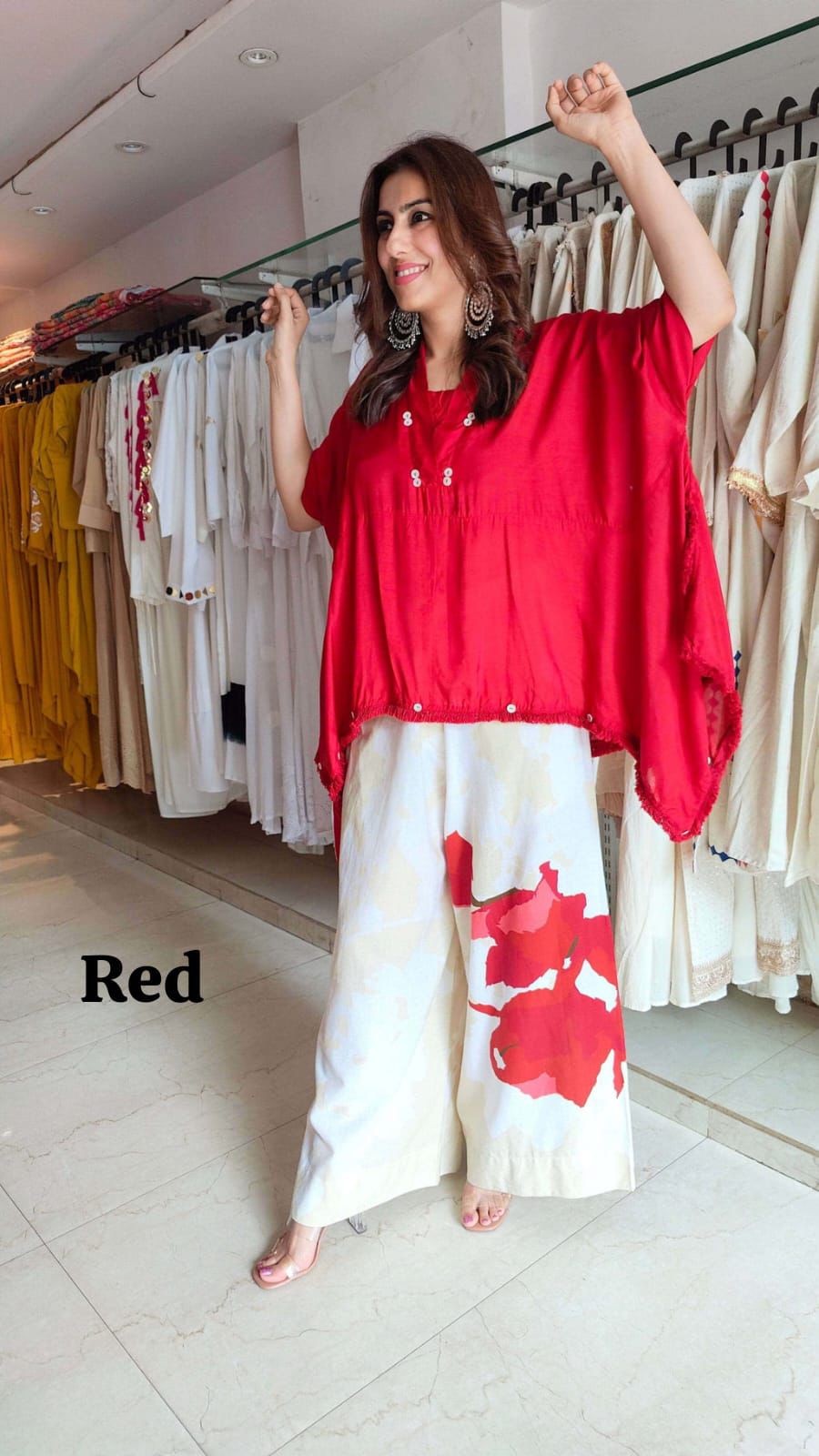 Red oversized top with printed wide-leg pants
