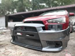 MITSUBISHI LANCER 09-15 SEDANO EVO STYLE priekinis bamperis
