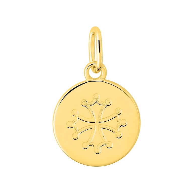 Medalla de oro con diseño grabado