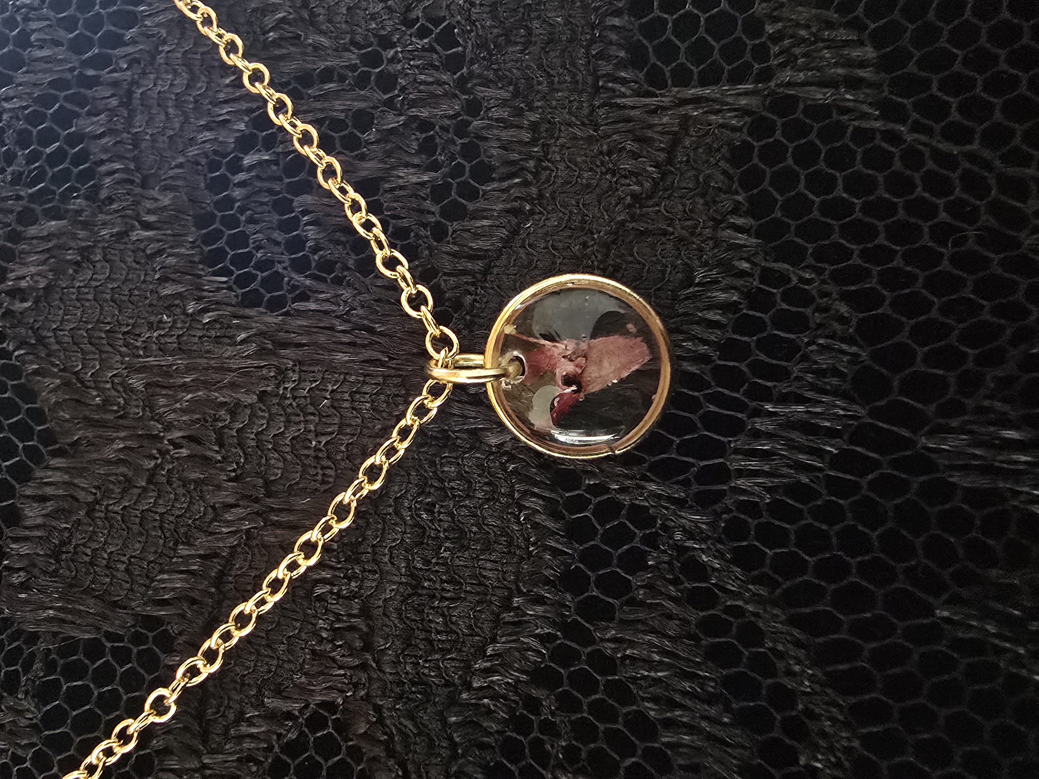 Mini gold pendant necklace featuring a real tiny Lantana flower