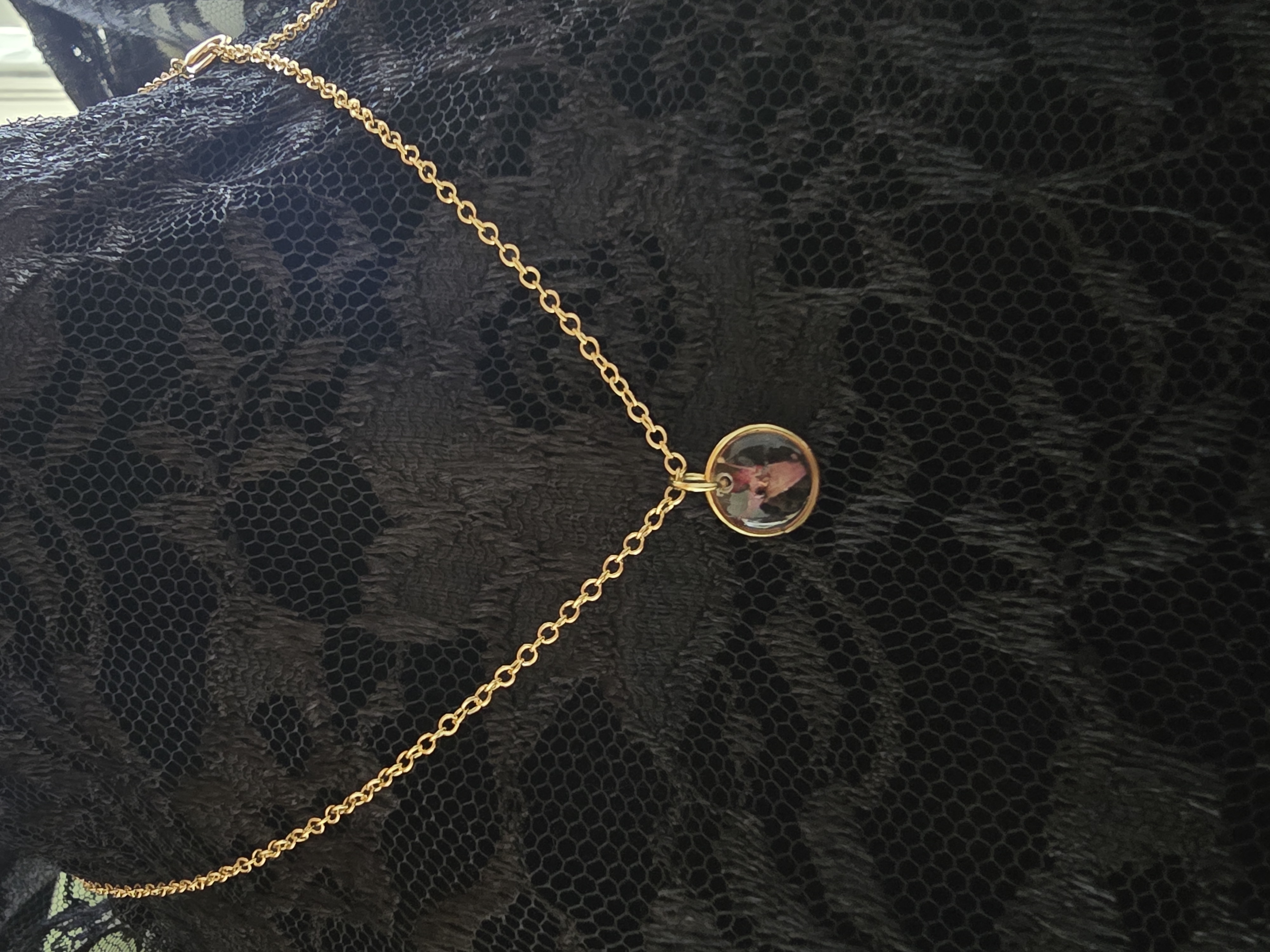 Mini gold pendant necklace featuring a real tiny Lantana flower