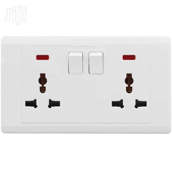 Double universal wall socket with switches
