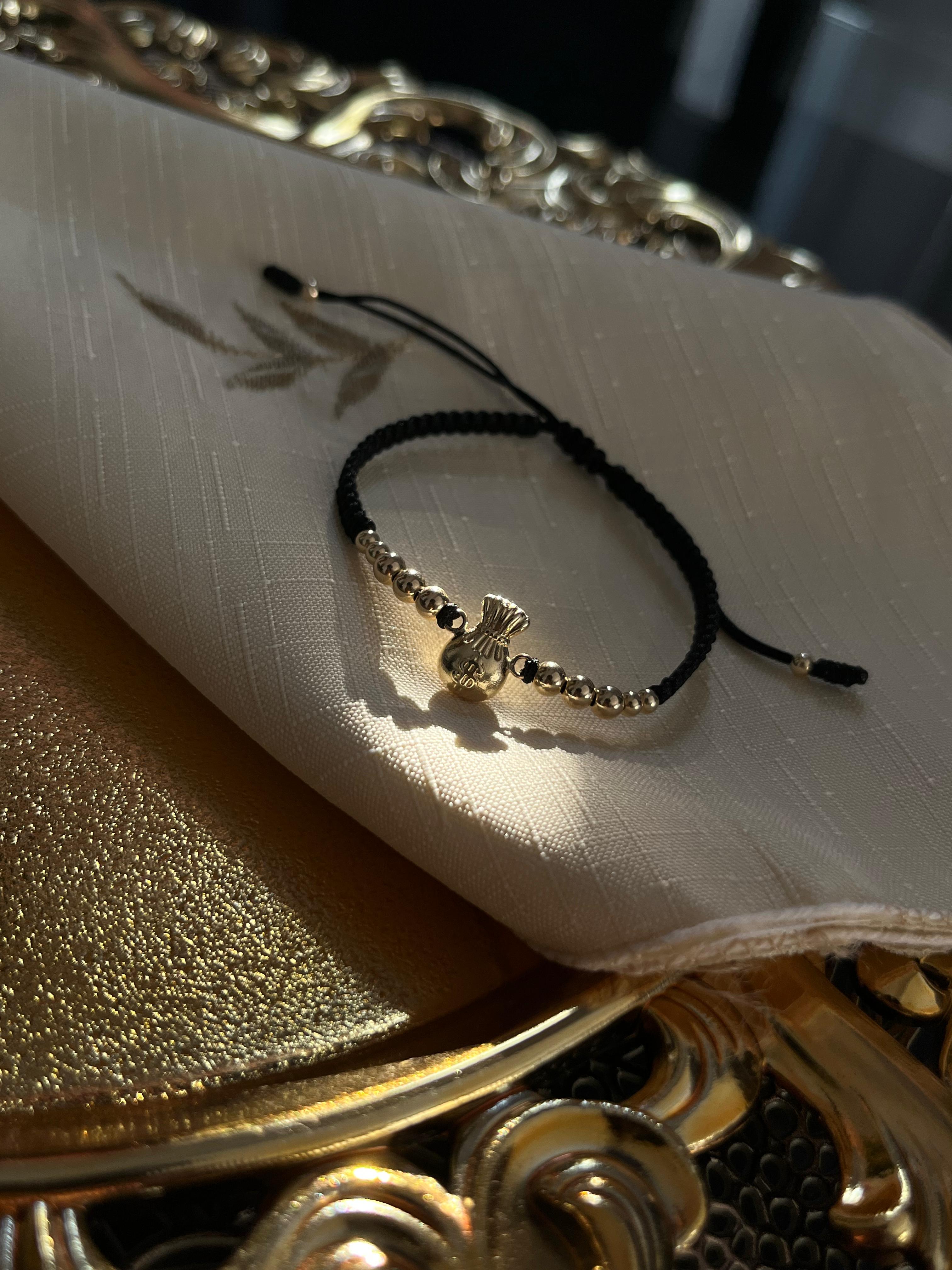 PULSERA HERRAJE BOLSA DE DINERO