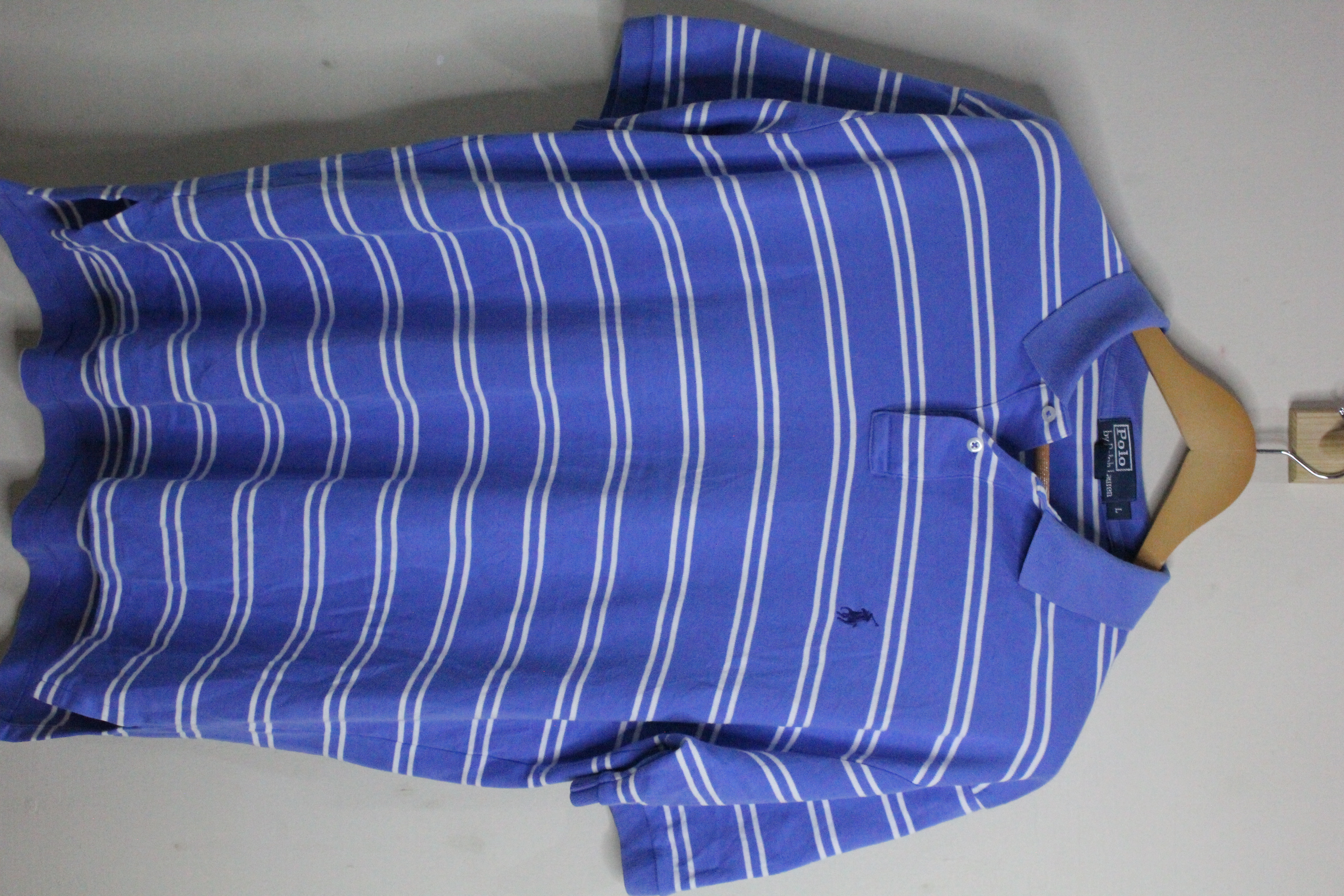 Blue striped polo shirt