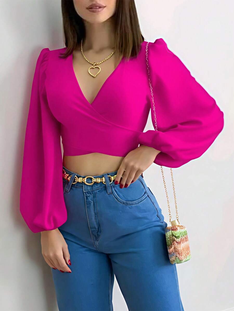 Blusa cruzada fucsia de manga larga