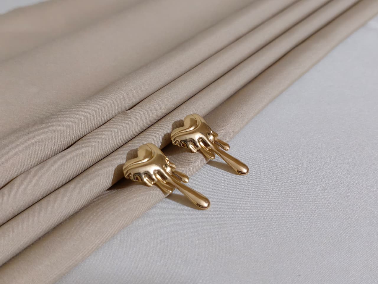 Gold Hand-Shaped Earnings