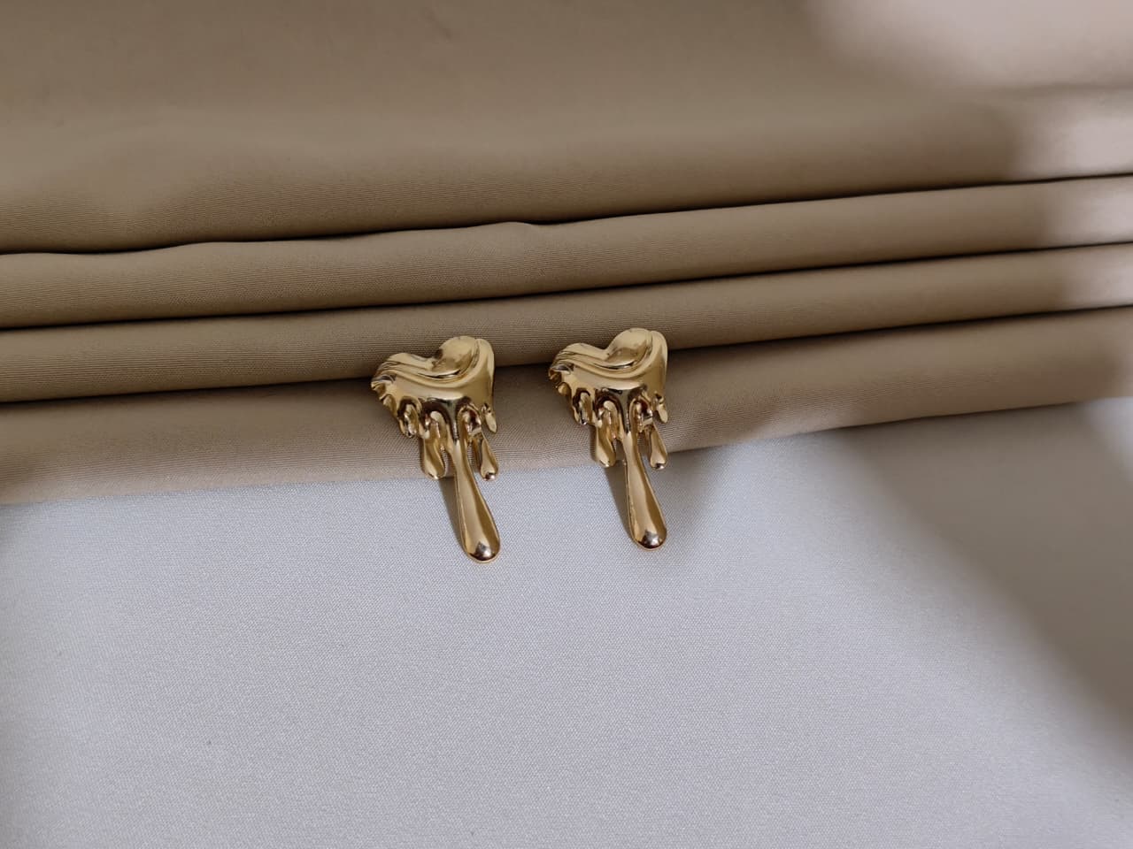 Gold Hand-Shaped Earnings