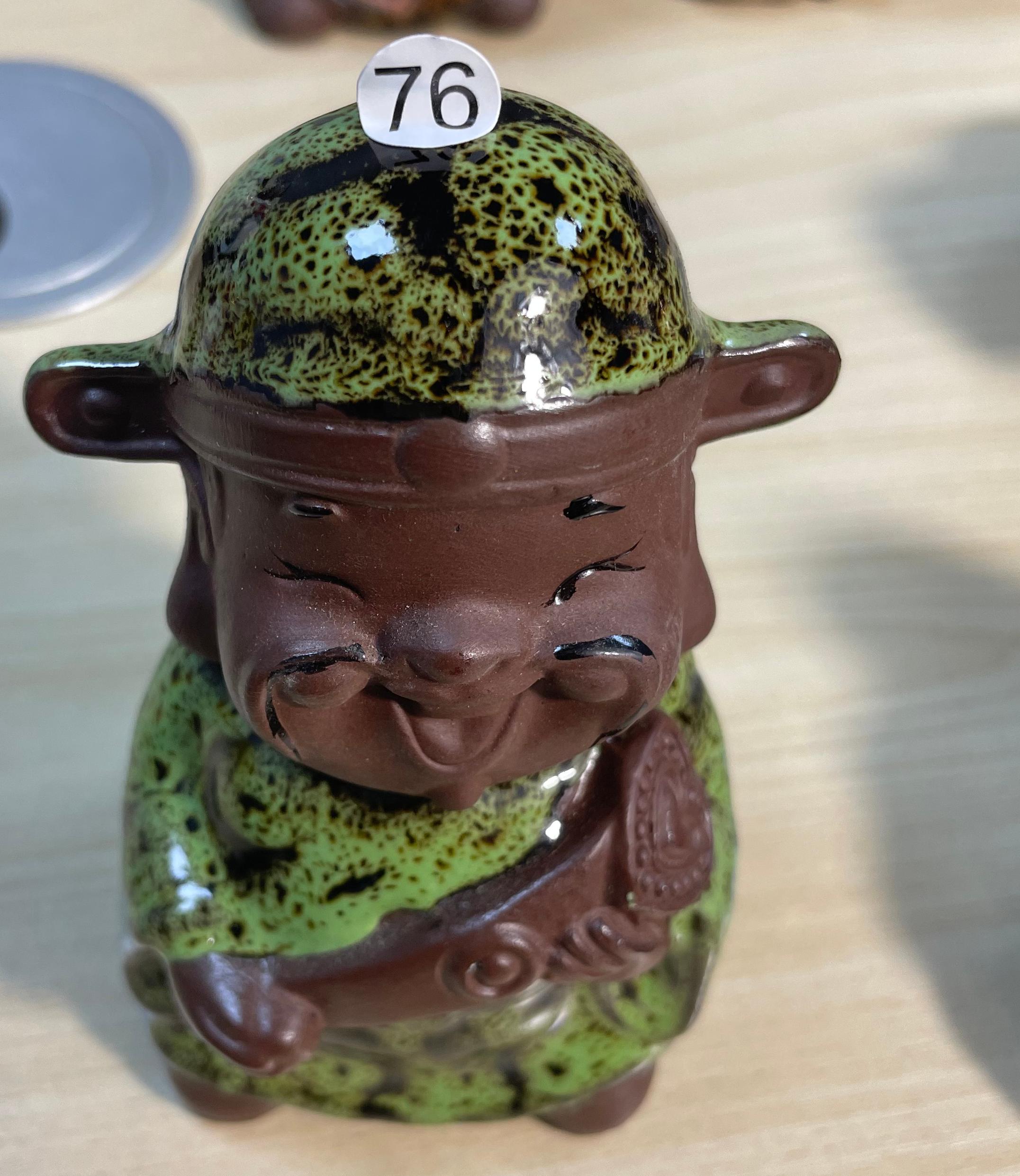 Green ceramic figurine
