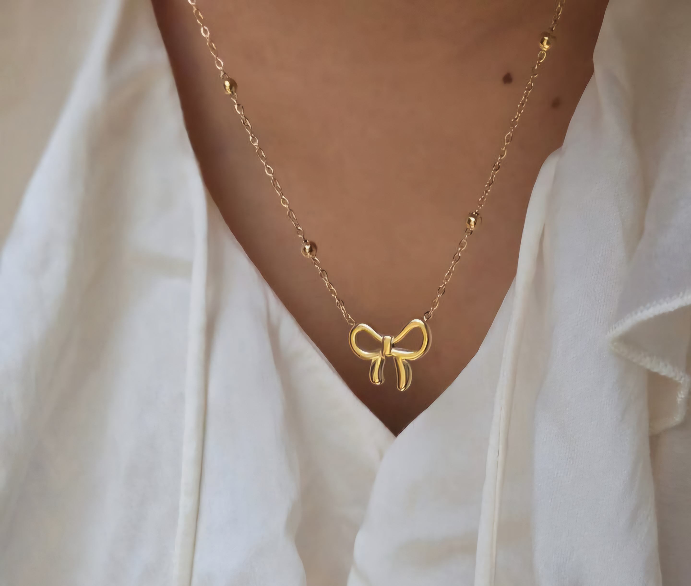 Gold Bow Pendant Necklace