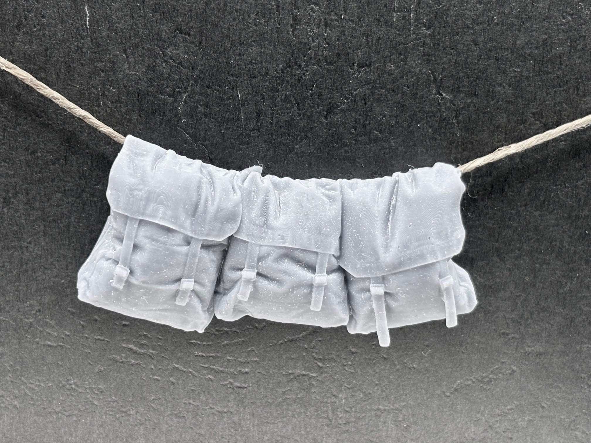 37 Pattern packs hanging on rope.