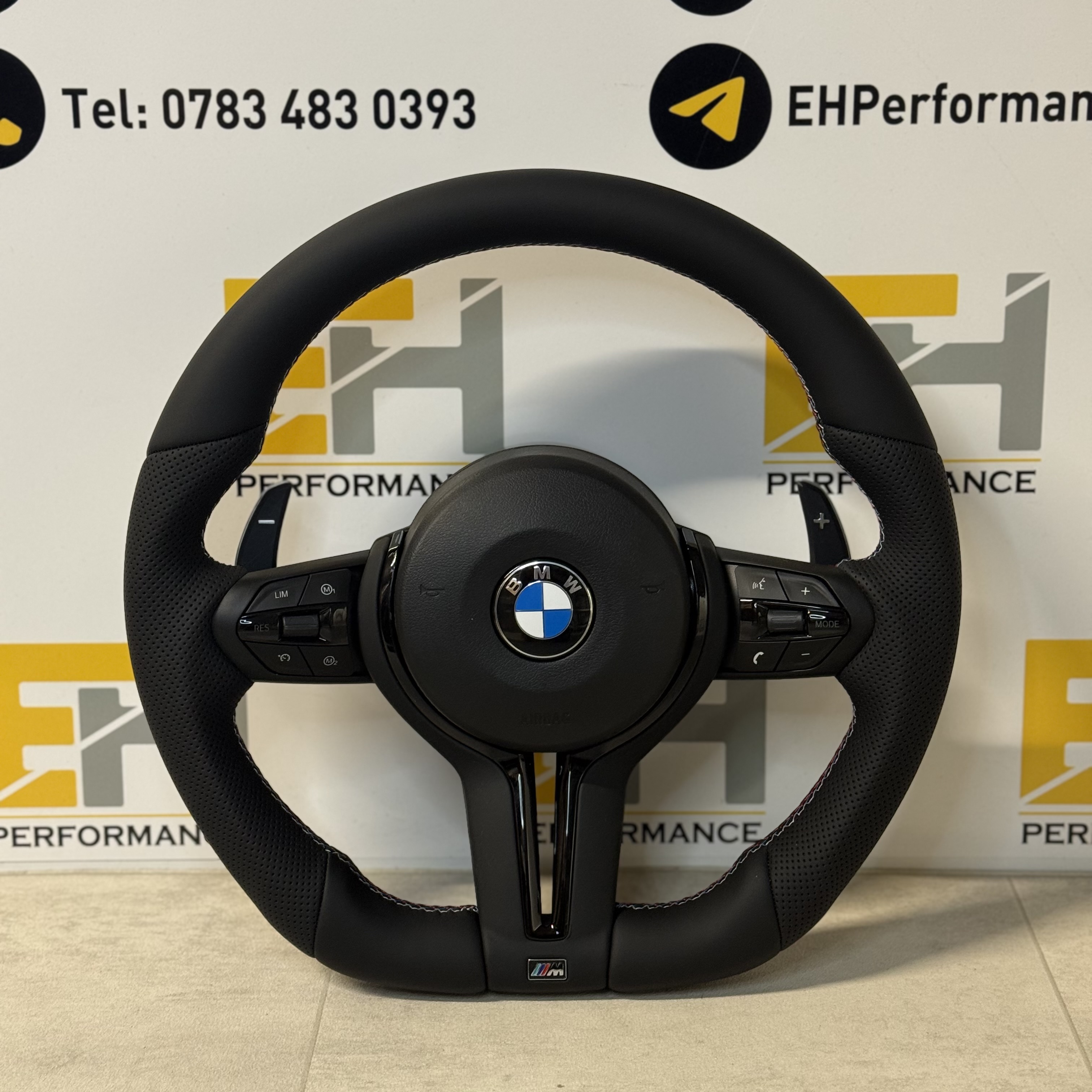 BMW custom perforated leather steering wheel with m sport and gloss black trim