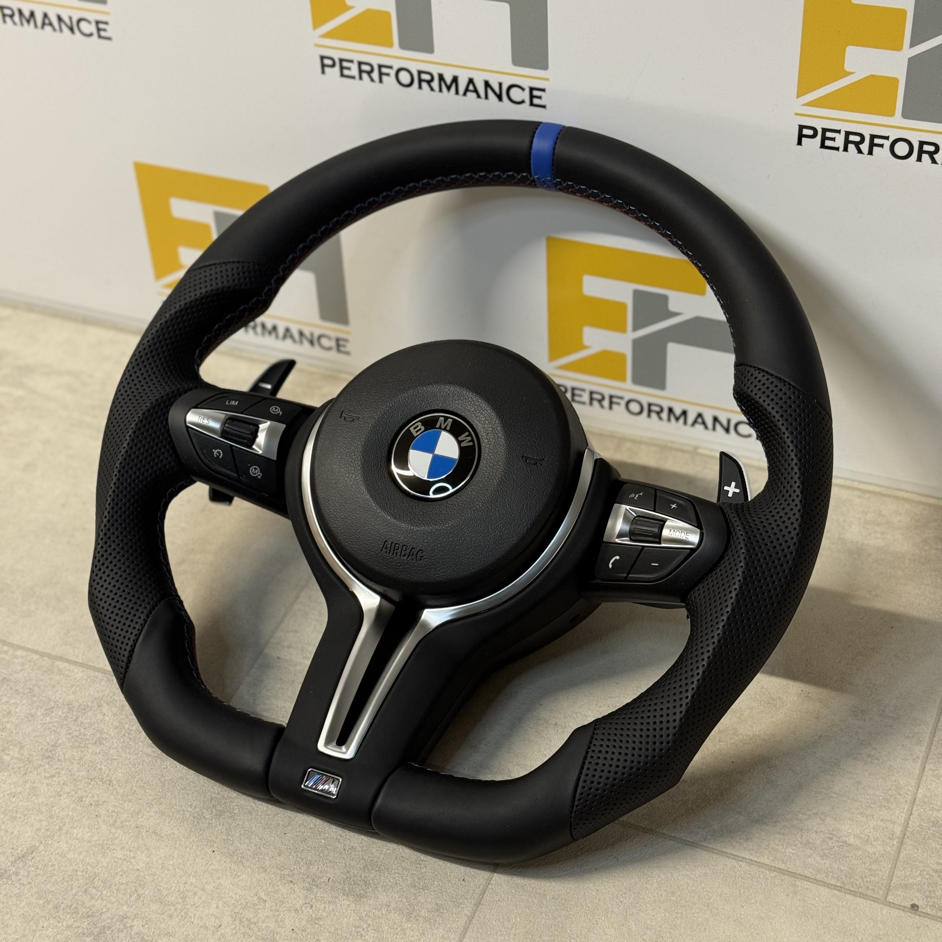 BMW custom perforated leather steering wheel with m sport and blue centre stripe