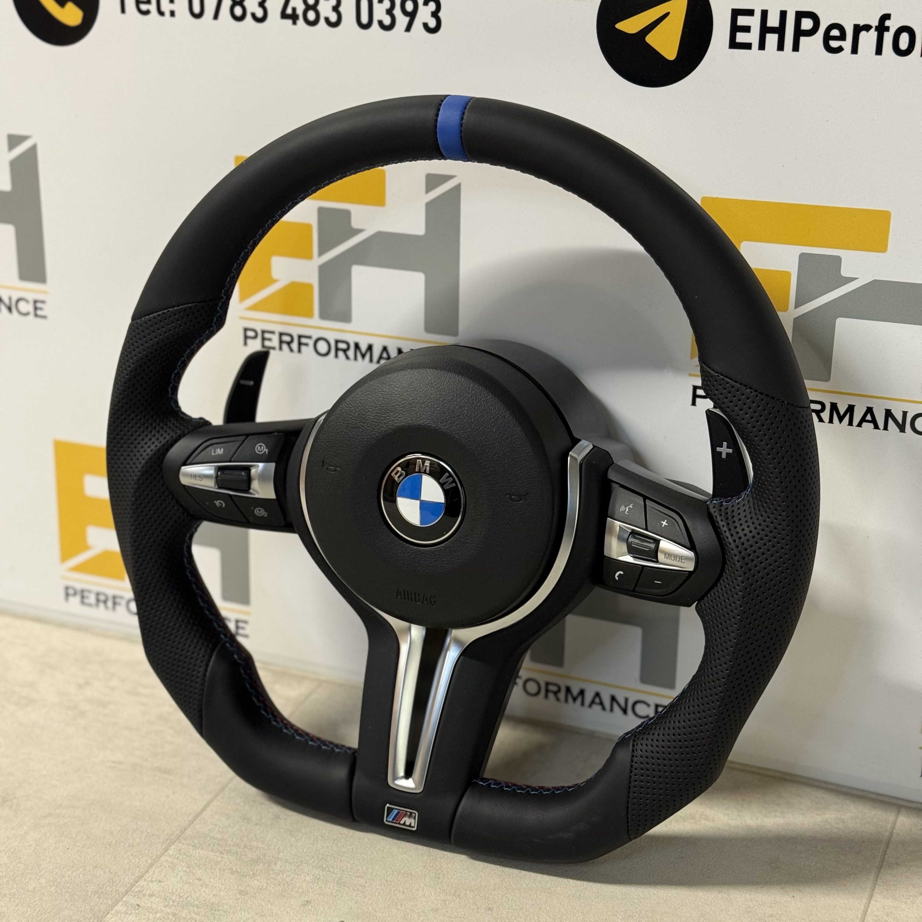 BMW custom perforated leather steering wheel with m sport and blue centre stripe