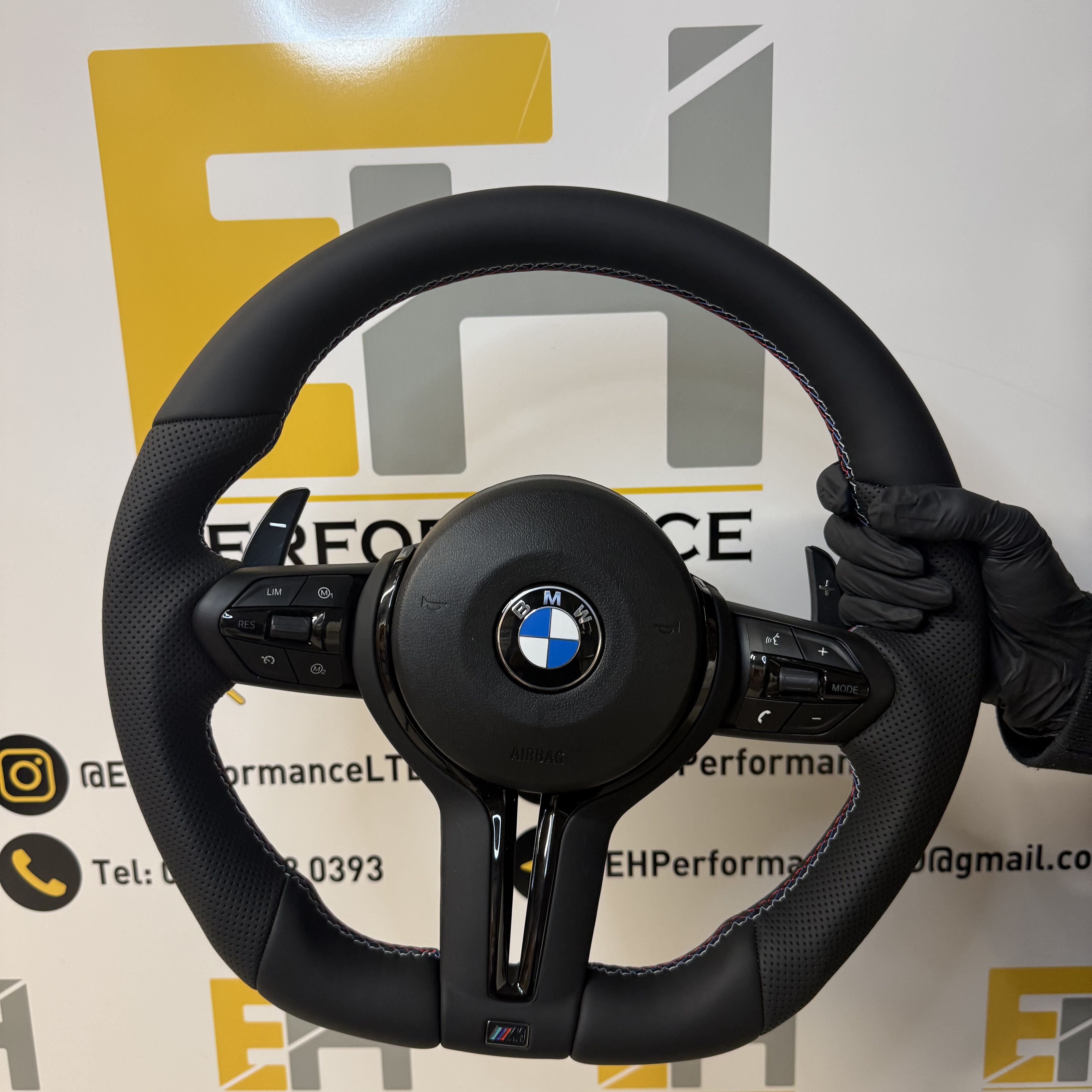 BMW custom perforated leather steering wheel with m sport and gloss black trim