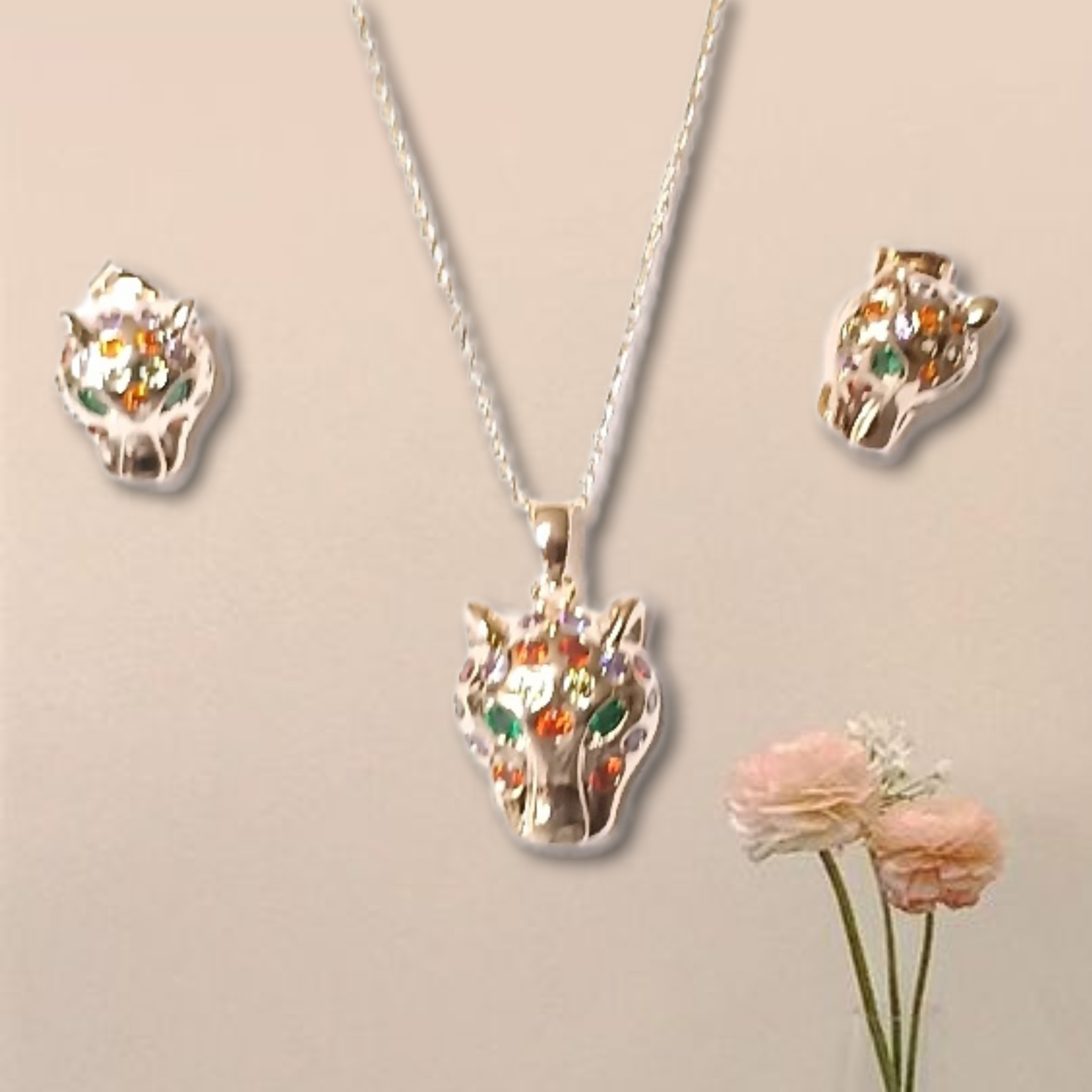 Conjunto de colgante y aretes de Jaguar