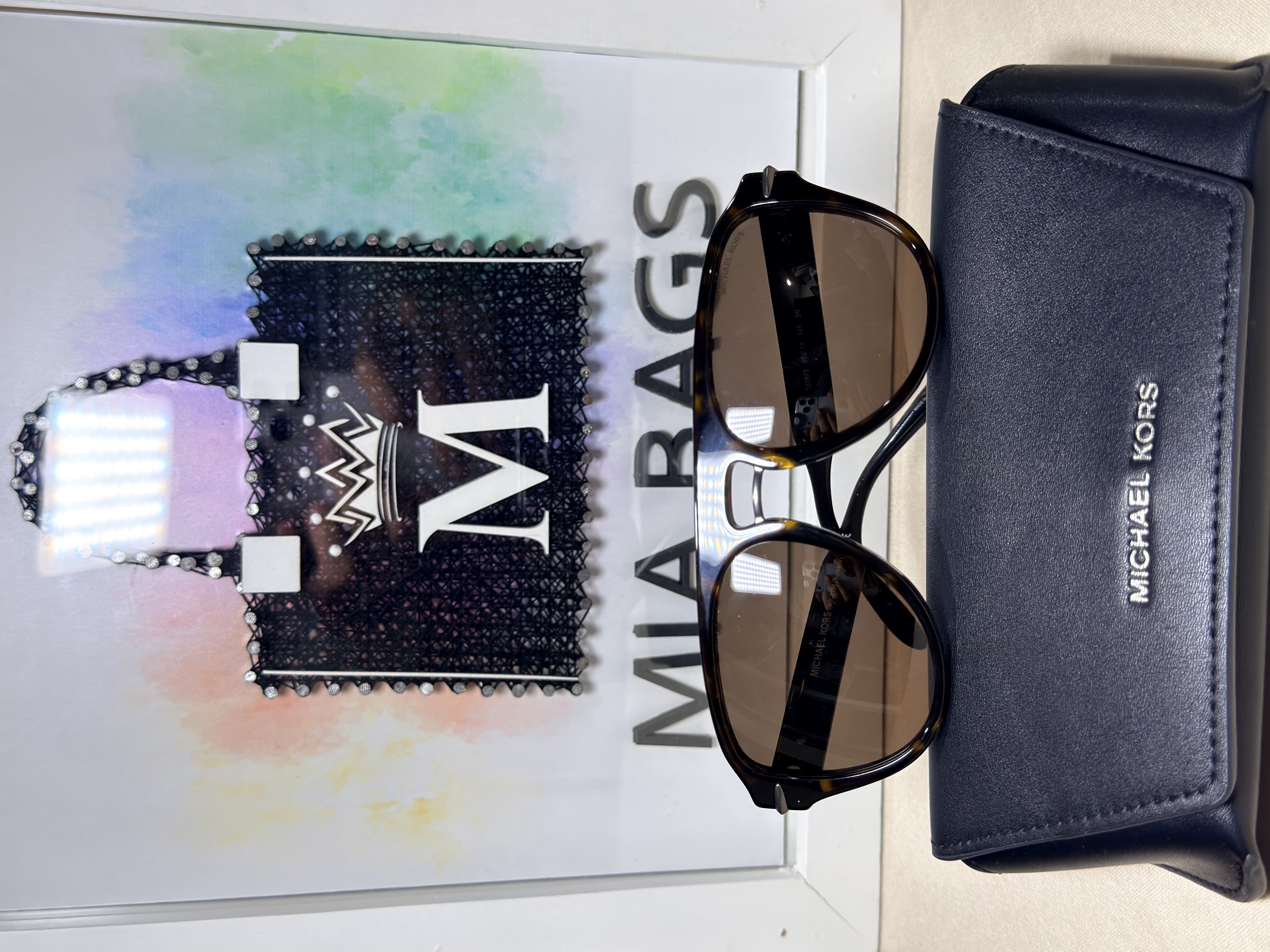 Gafas de sol color café, poste con monogram