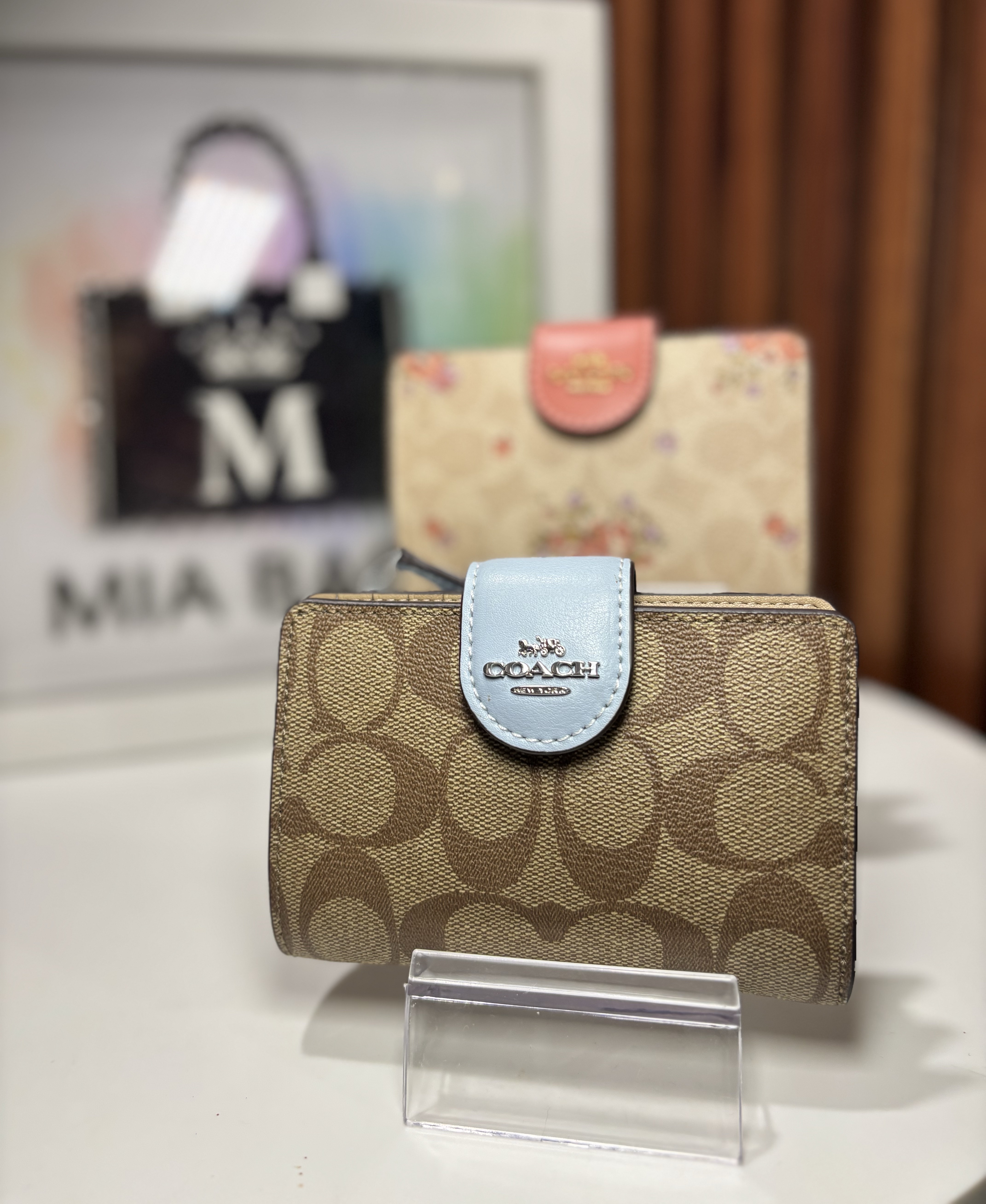 Cartera Coach con clip