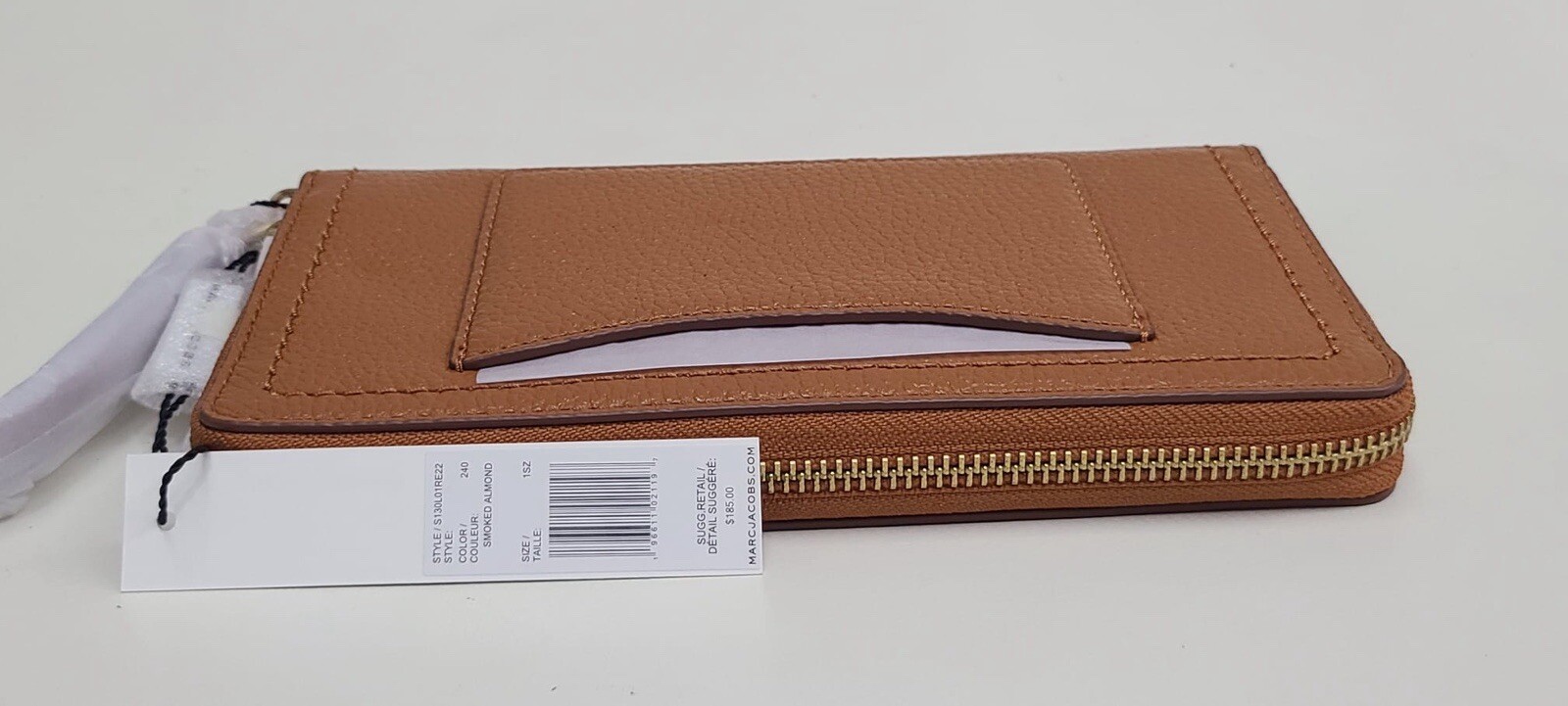 Cartera con cierre y muñequera beige