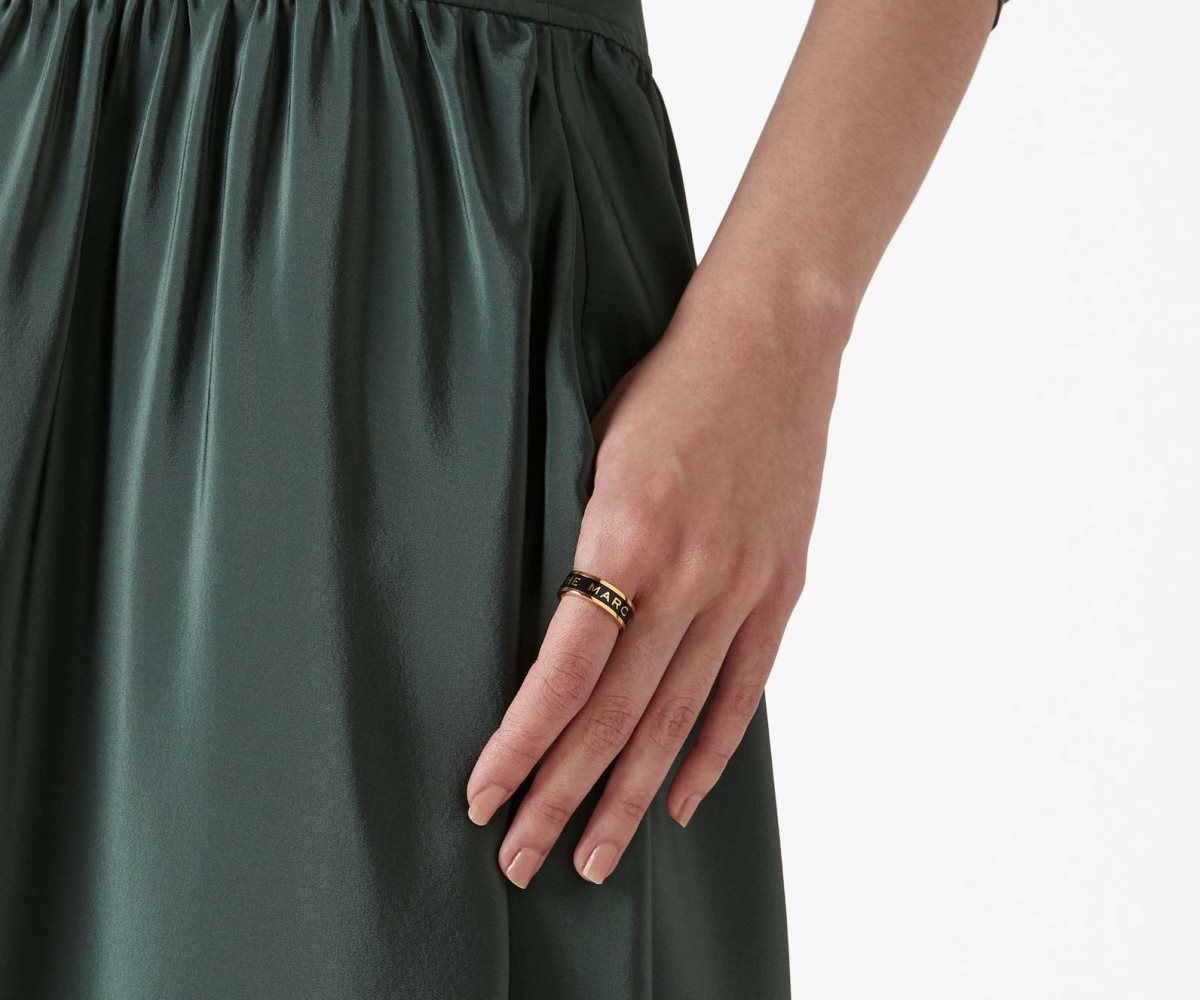 Anillo negro con dorado 