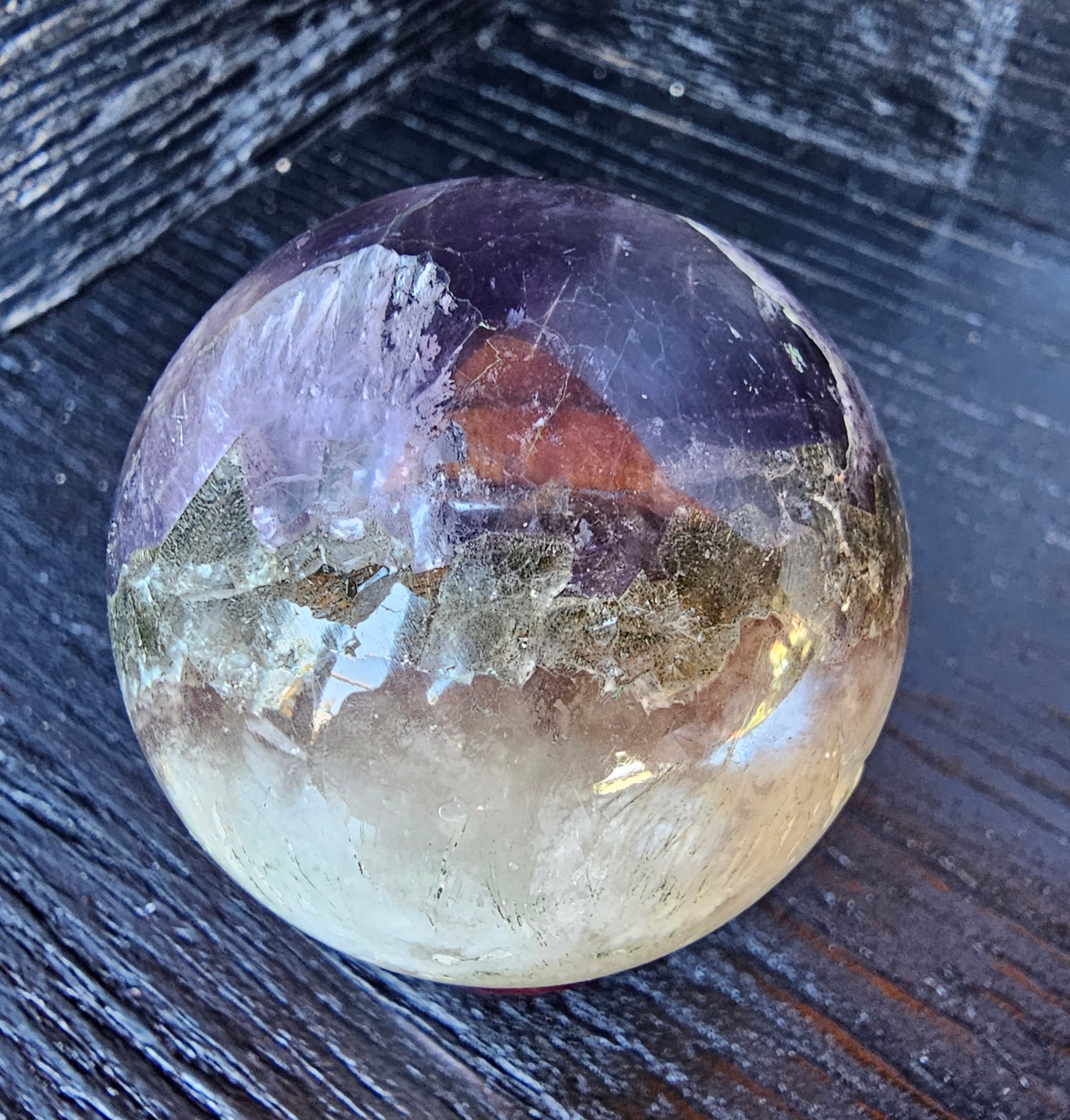 Rare Red rabbit hair, UV reactive blue fluorite, UV reactive pink calcite inclusions with cubic pyrite inclusion banding. 