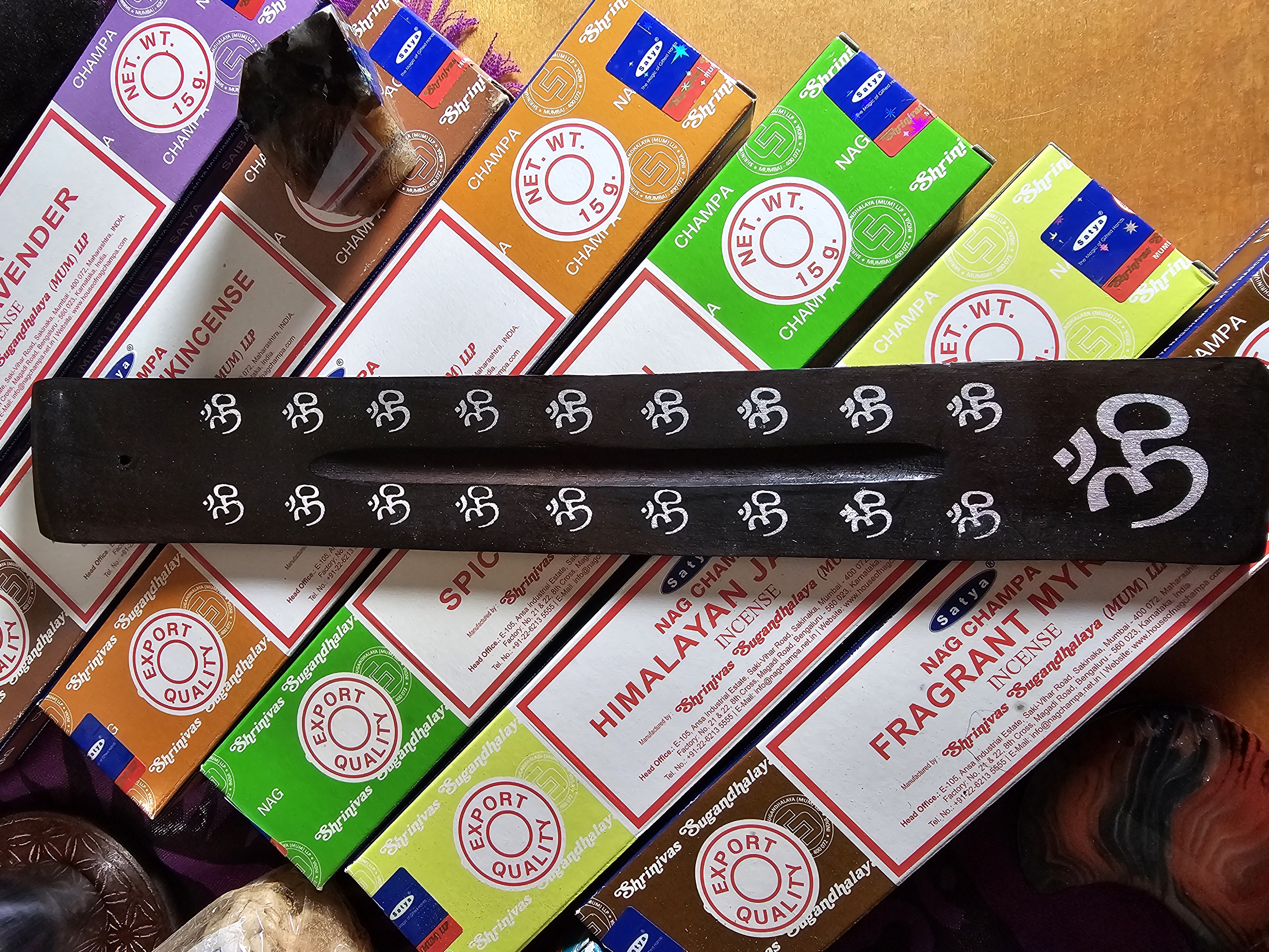 Om black, painted, wooden boat style incense burner