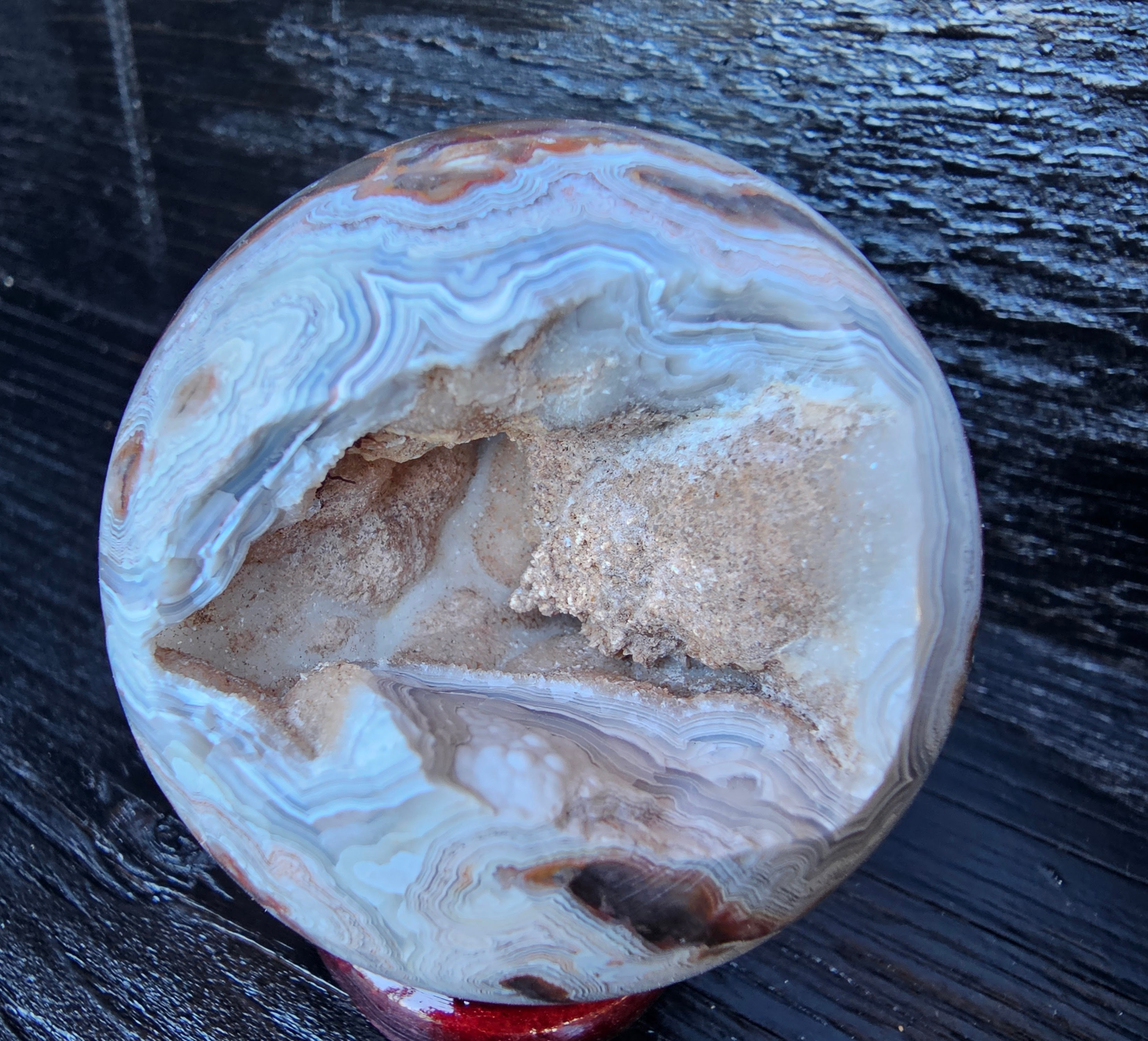 Stunning Crazy lace sphere with a cool drusy cave