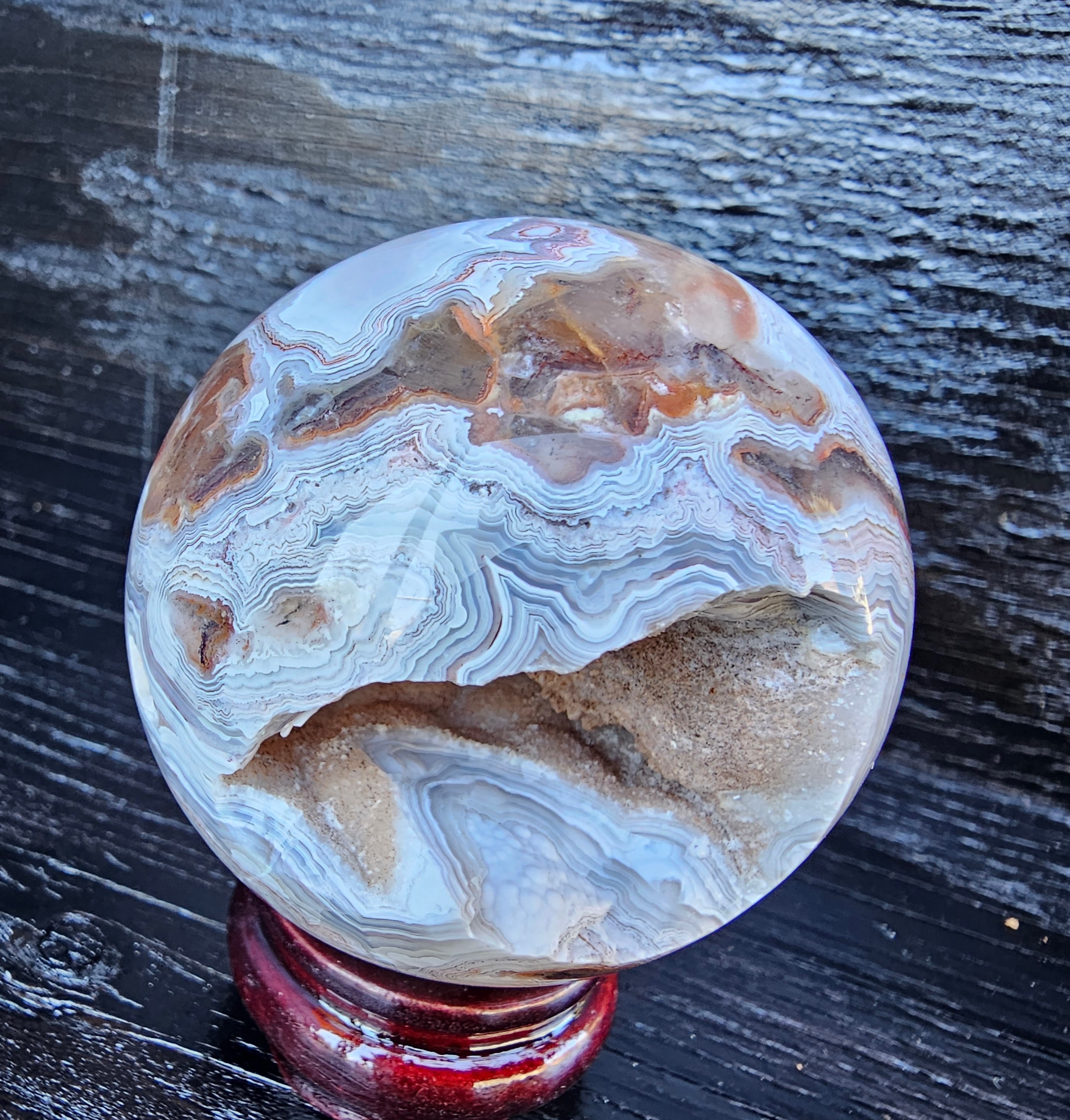 Stunning Crazy lace sphere with a cool drusy cave