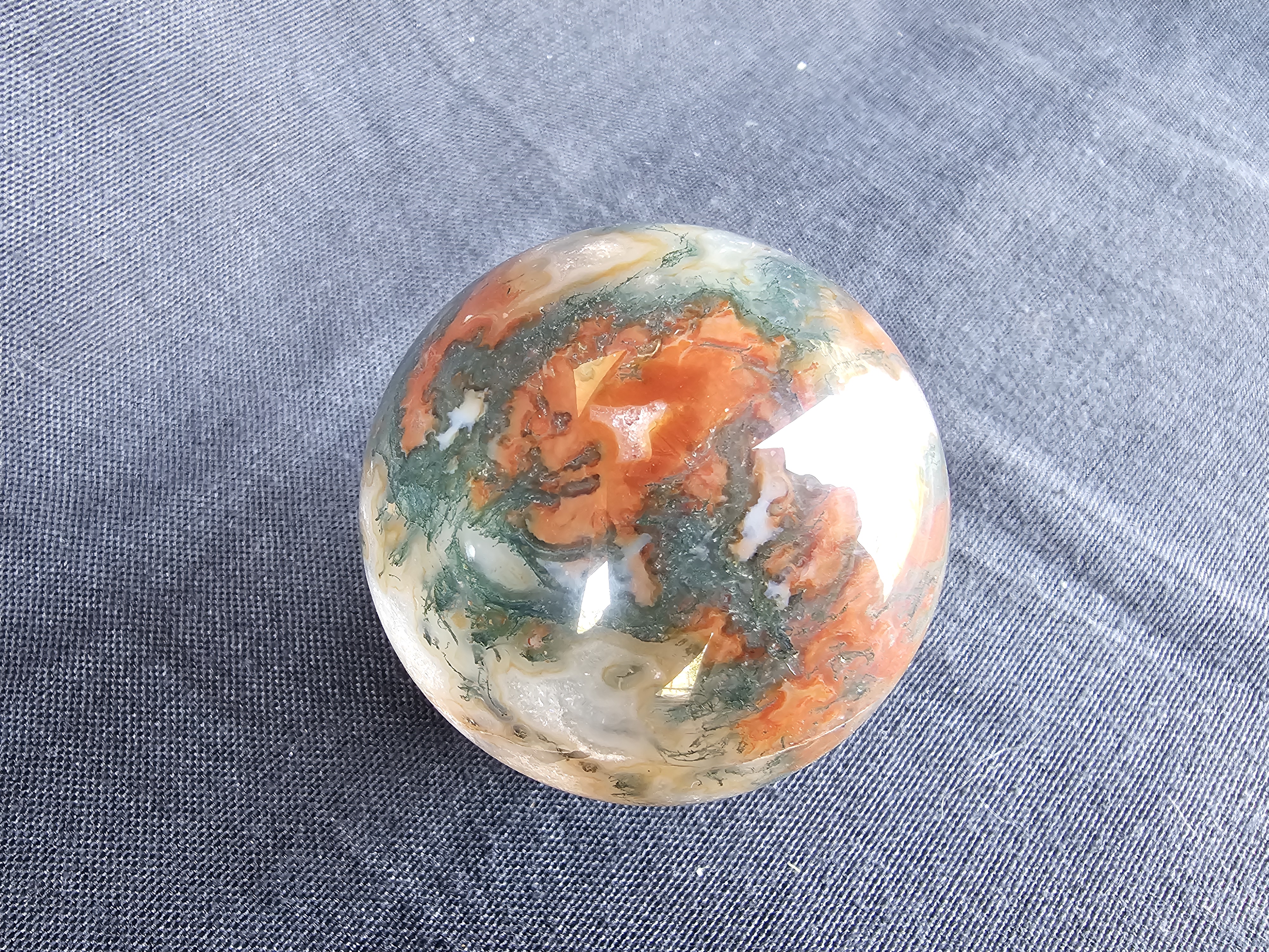 Amazing and unusual red moss agate sphere!