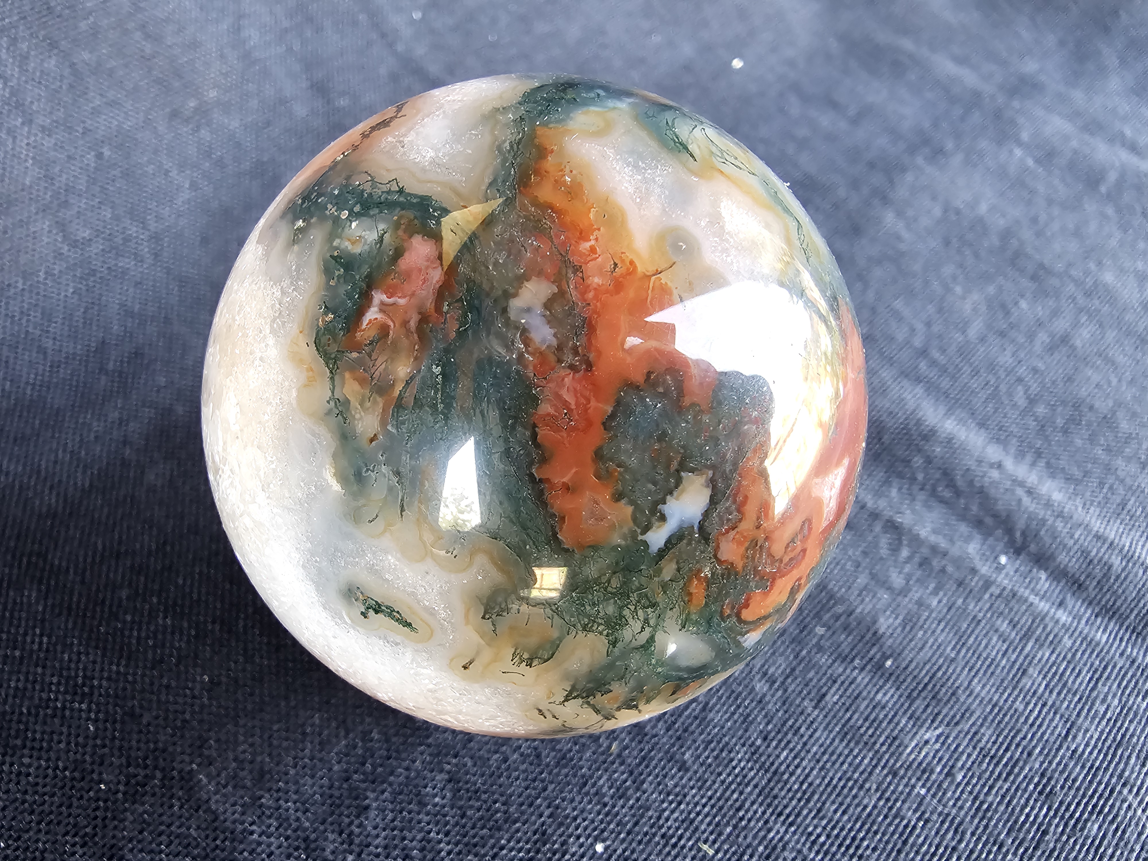 Amazing and unusual red moss agate sphere!