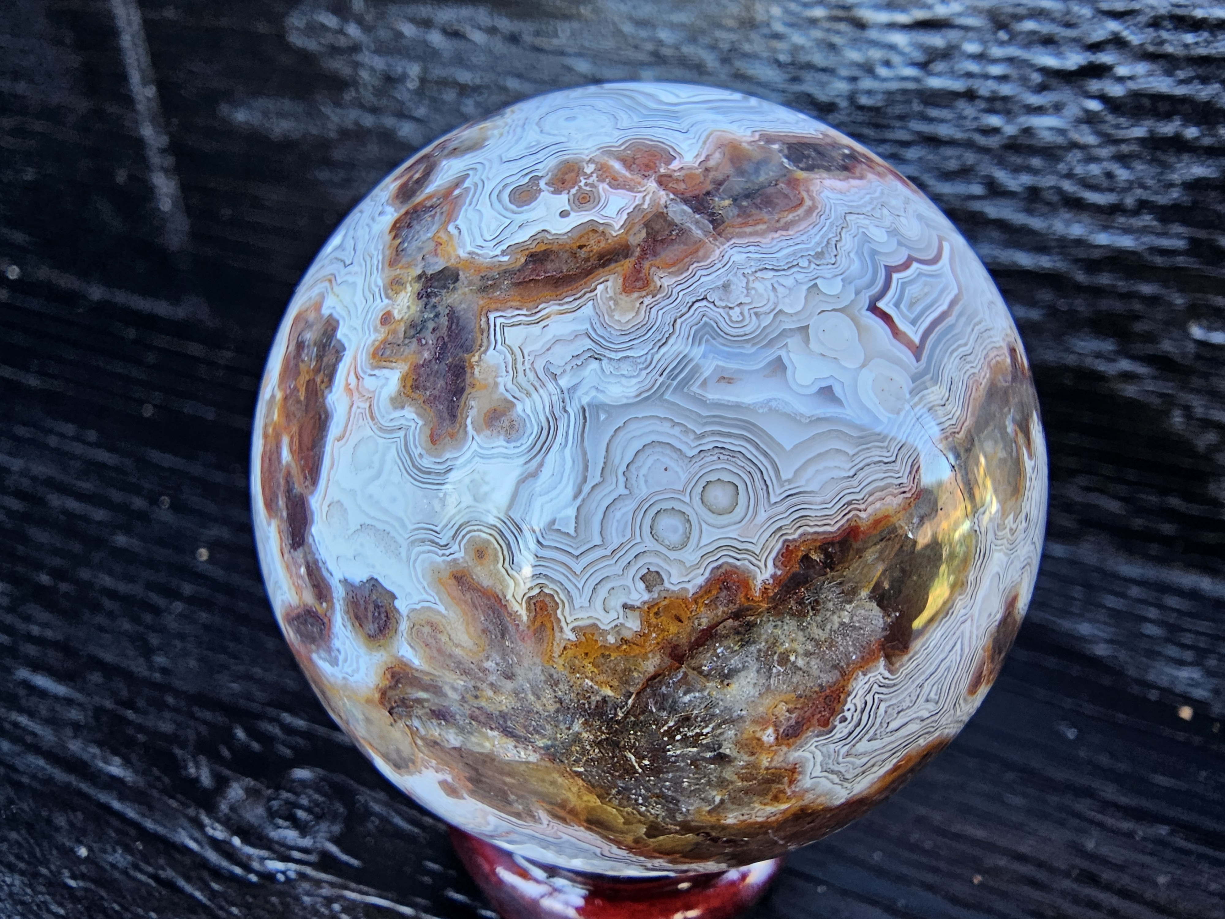 Stunning Crazy lace sphere with a cool drusy cave