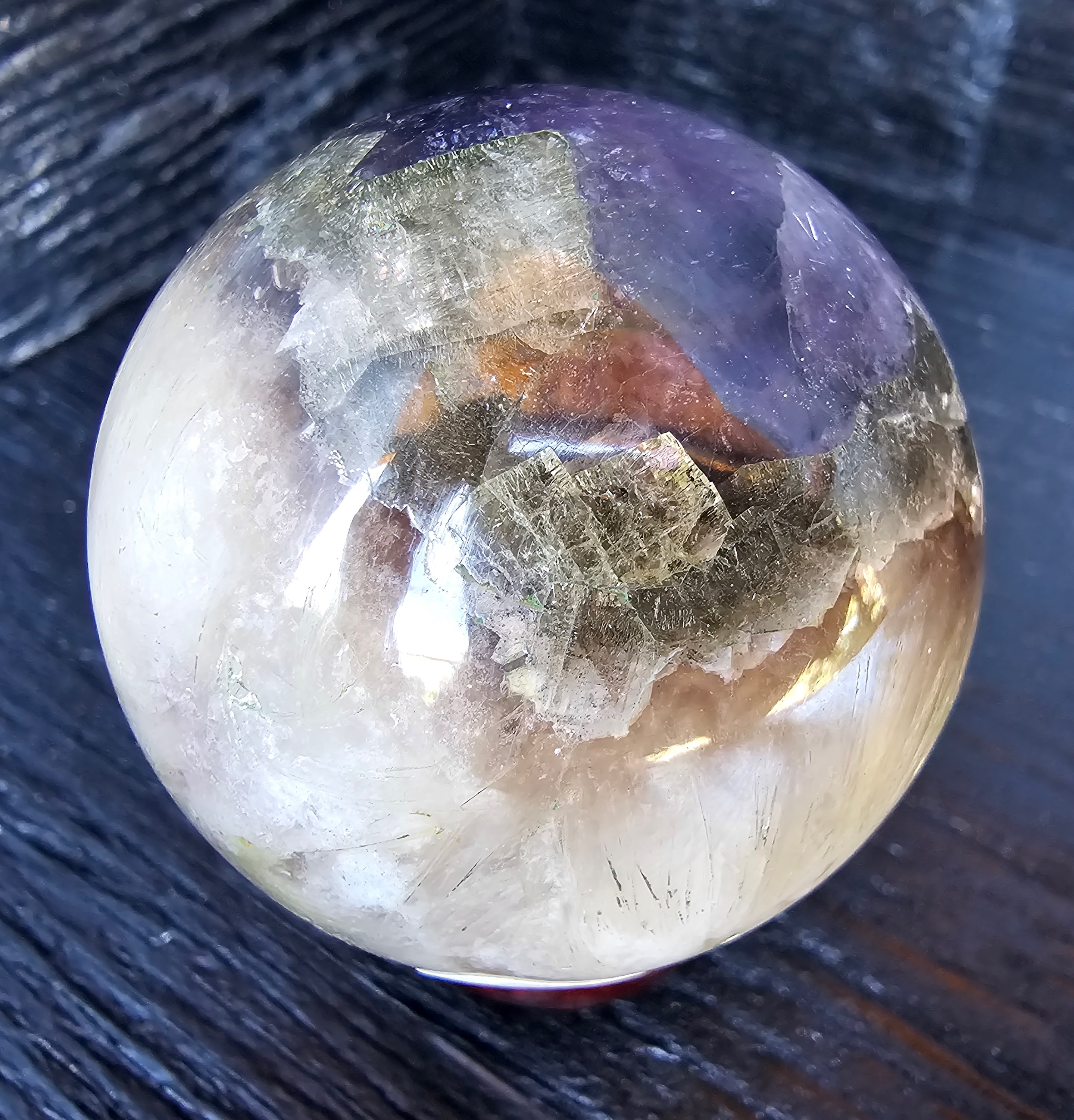 Rare Red rabbit hair, UV reactive blue fluorite, UV reactive pink calcite inclusions with cubic pyrite inclusion banding. 