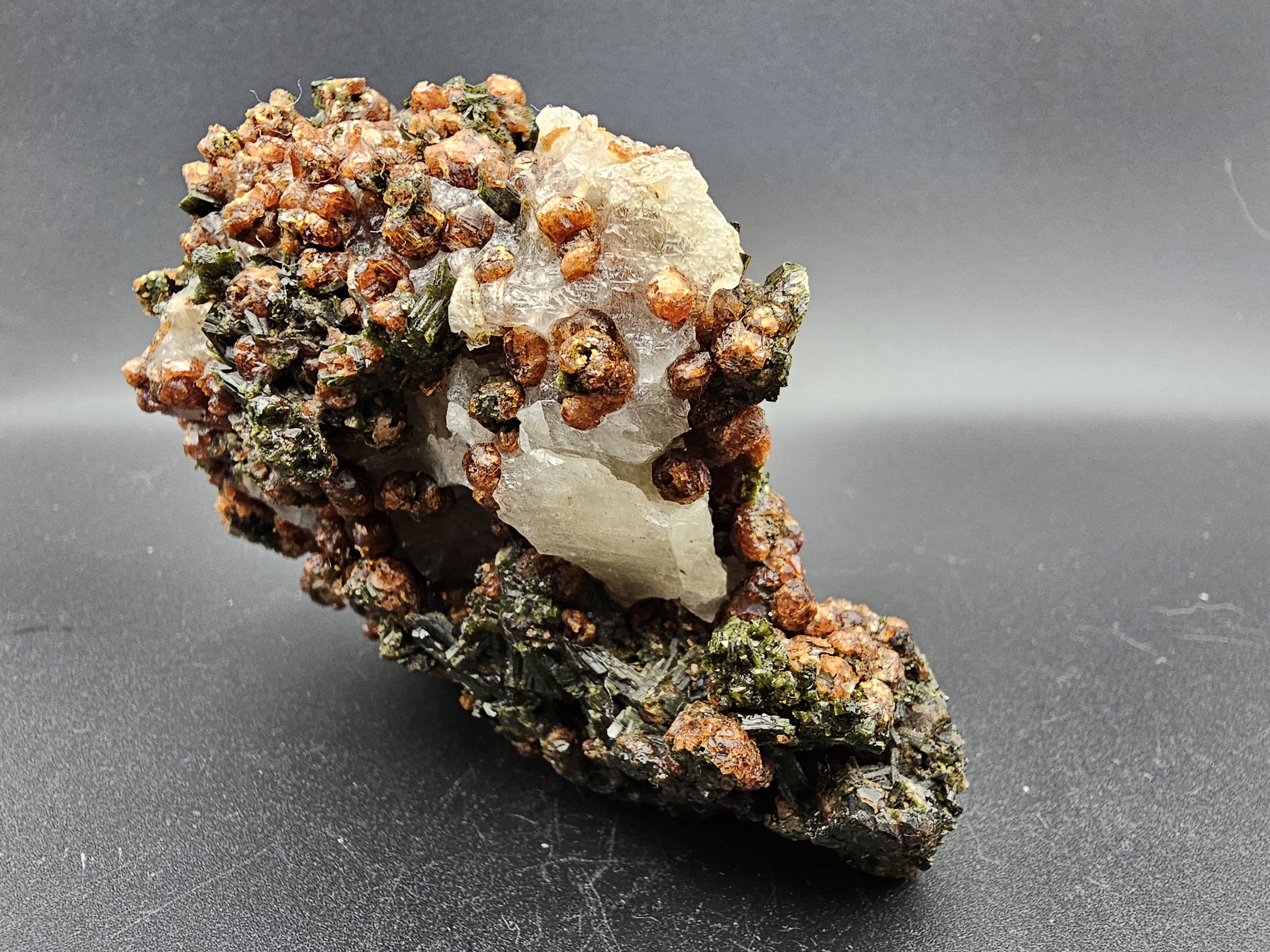 TONS of Raw Garnet and Epidote on a Calcite Host Material