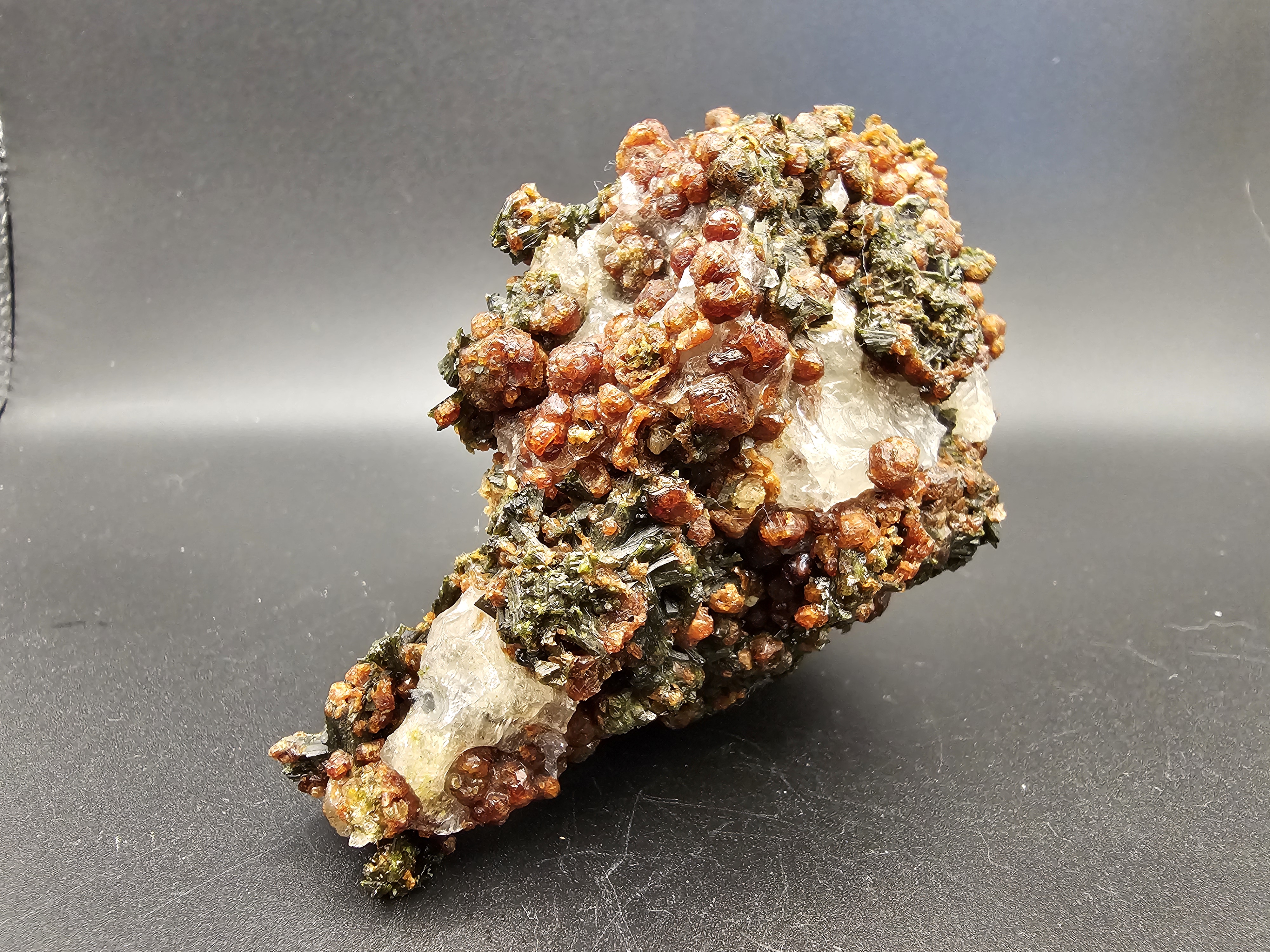 TONS of Raw Garnet and Epidote on a Calcite Host Material