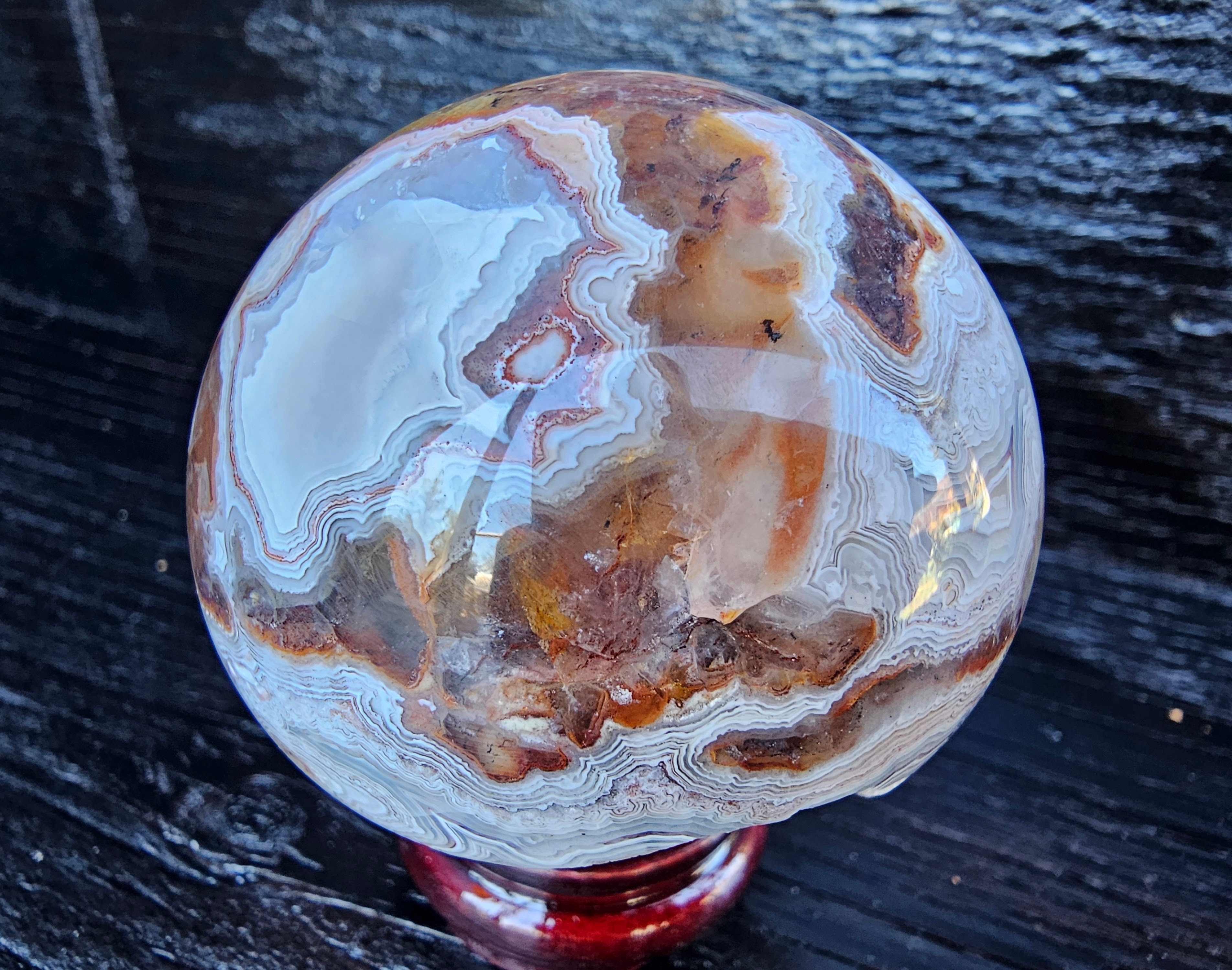 Stunning Crazy lace sphere with a cool drusy cave