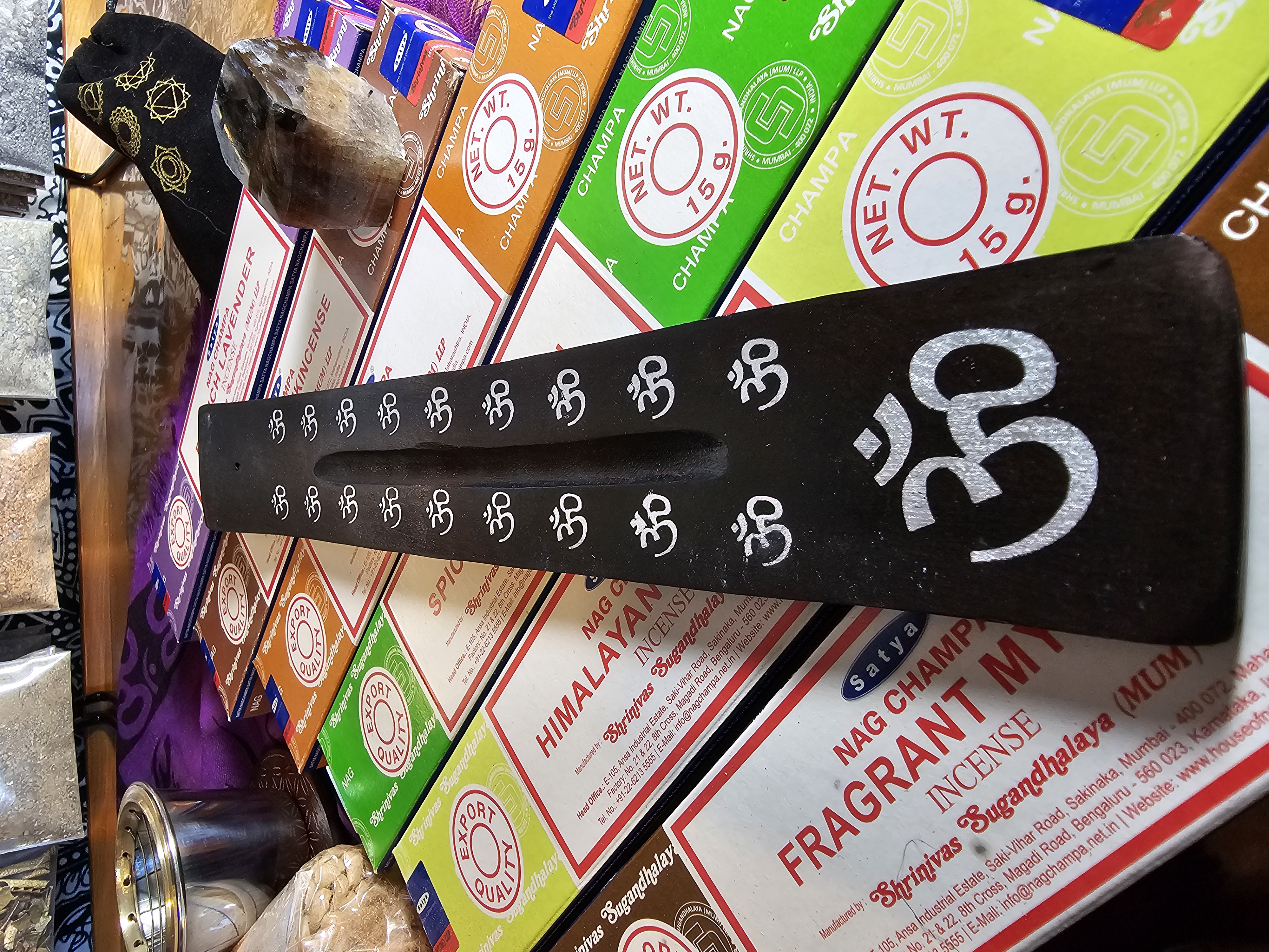 Om black, painted, wooden boat style incense burner