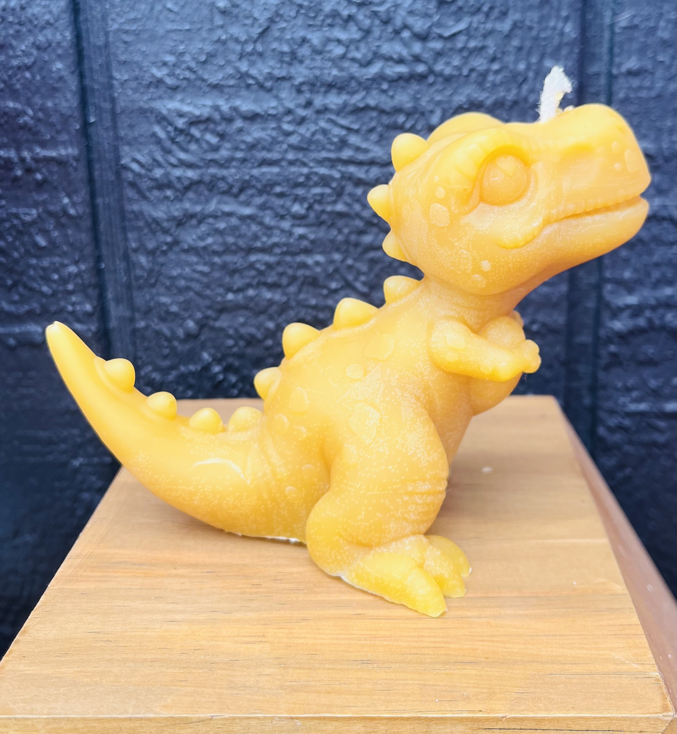 Dinosaur beeswax candle