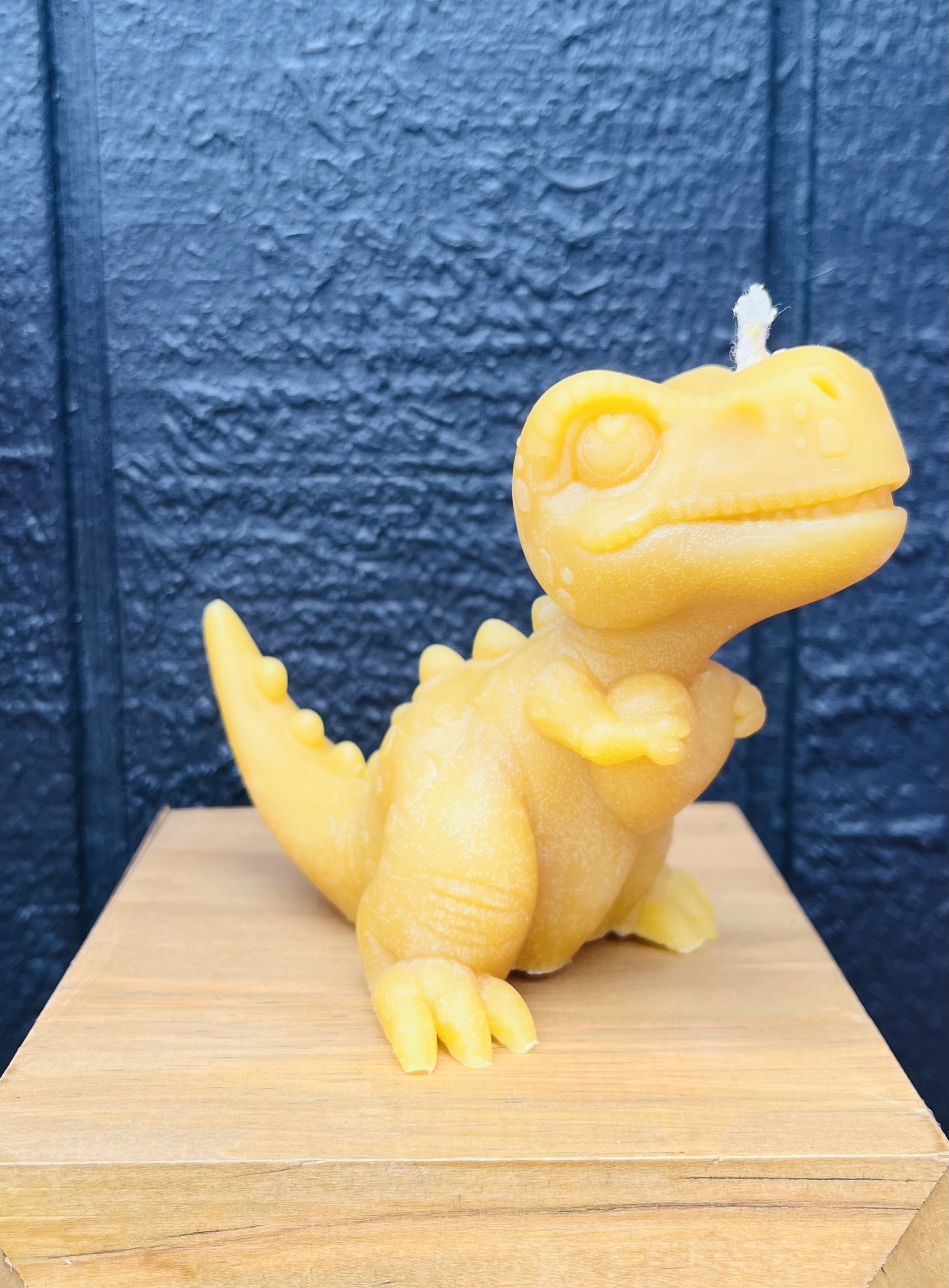 Dinosaur beeswax candle