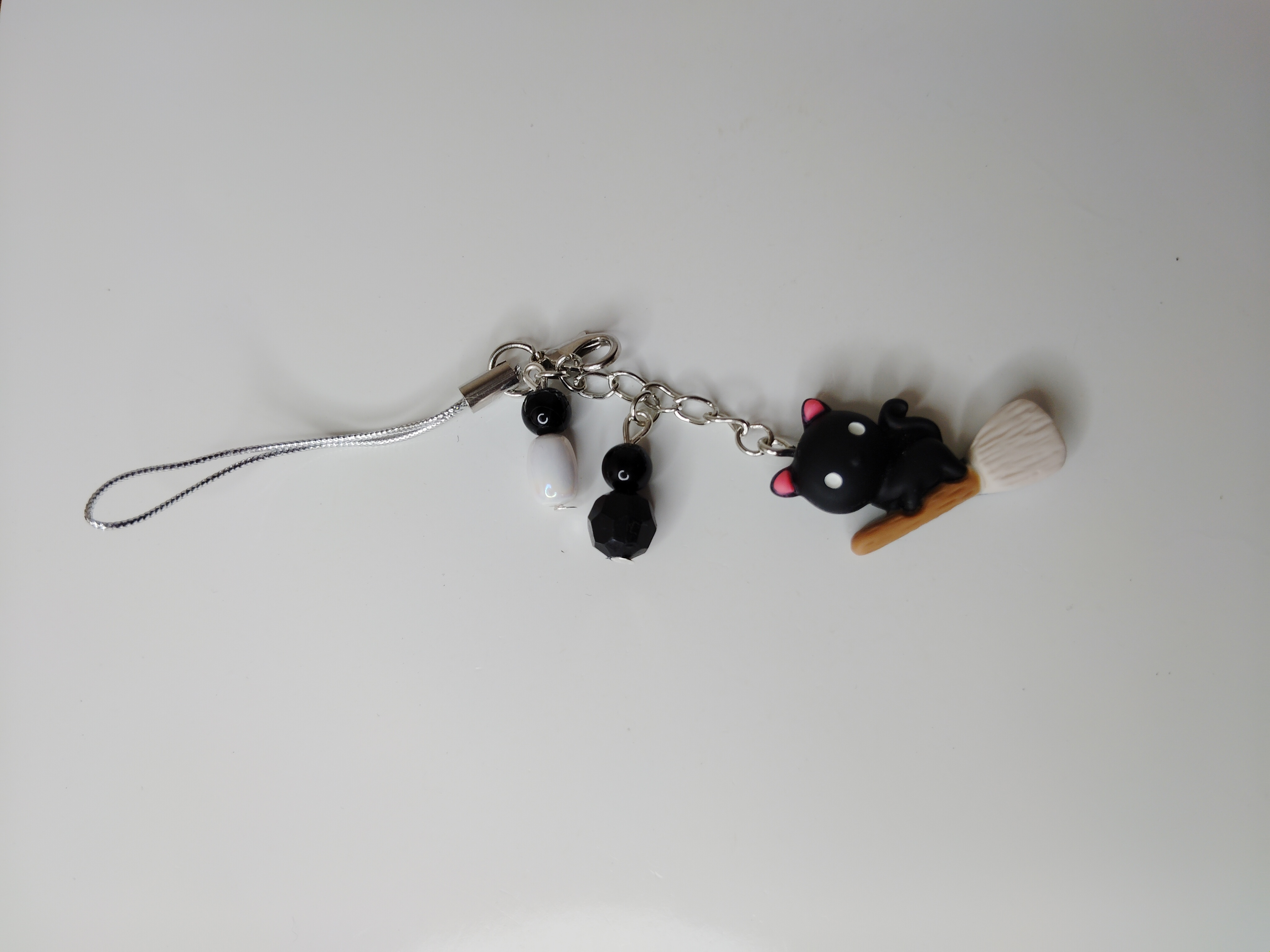 Cat on a Broom Phone Charm