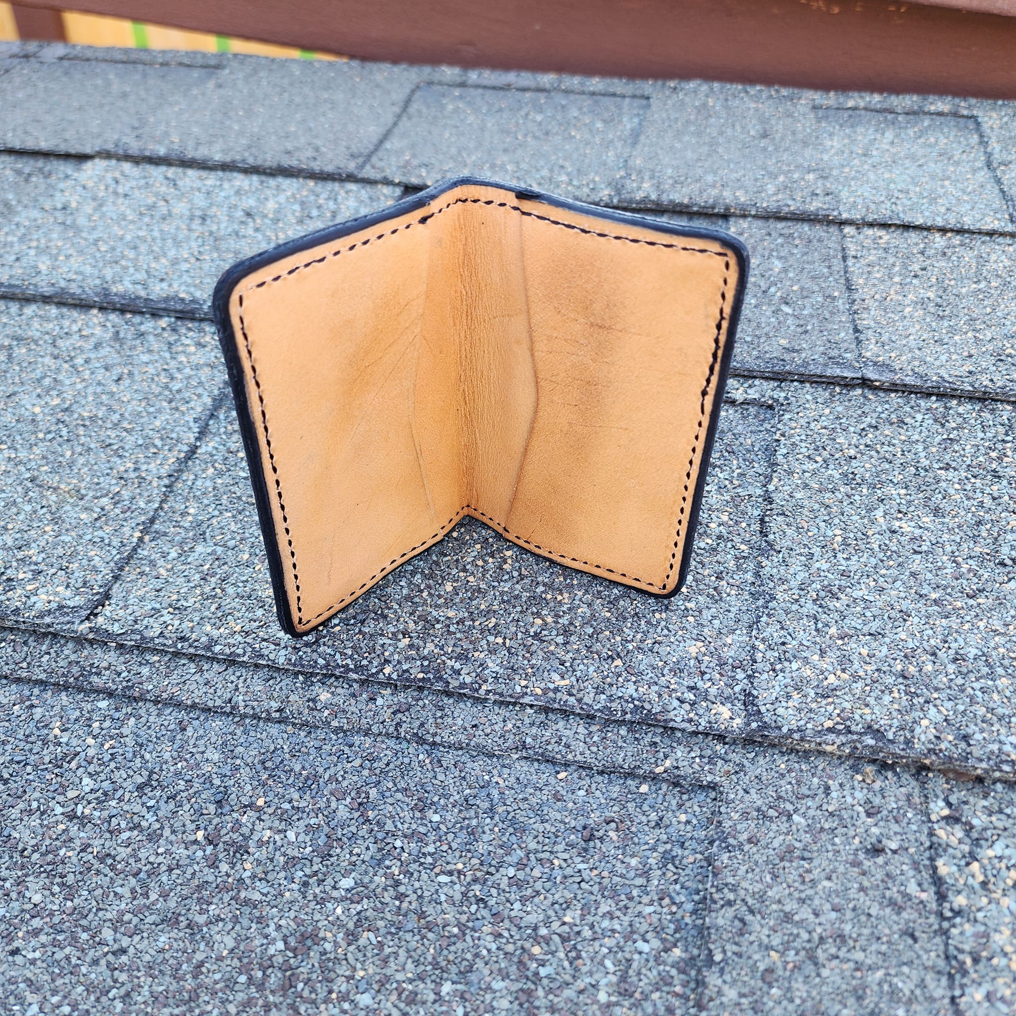 Leather minimalist wallet with engraved cowboy and cross